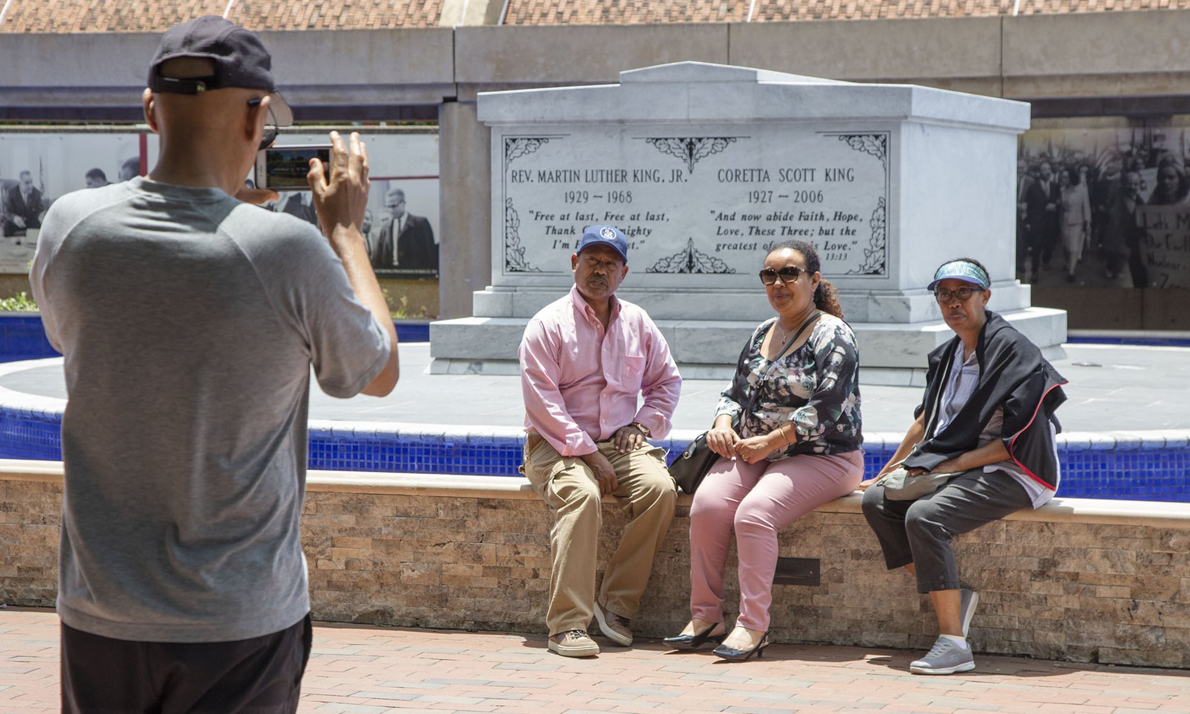 Yeah Beyene (back to camera, from Atlanta) takes a picture of his brother Wolde, sister in-law Meseret & sister Elsi (from Houston) at the Martin Luther King crypt in Atlanta on Thursday May 30th, 2019.
