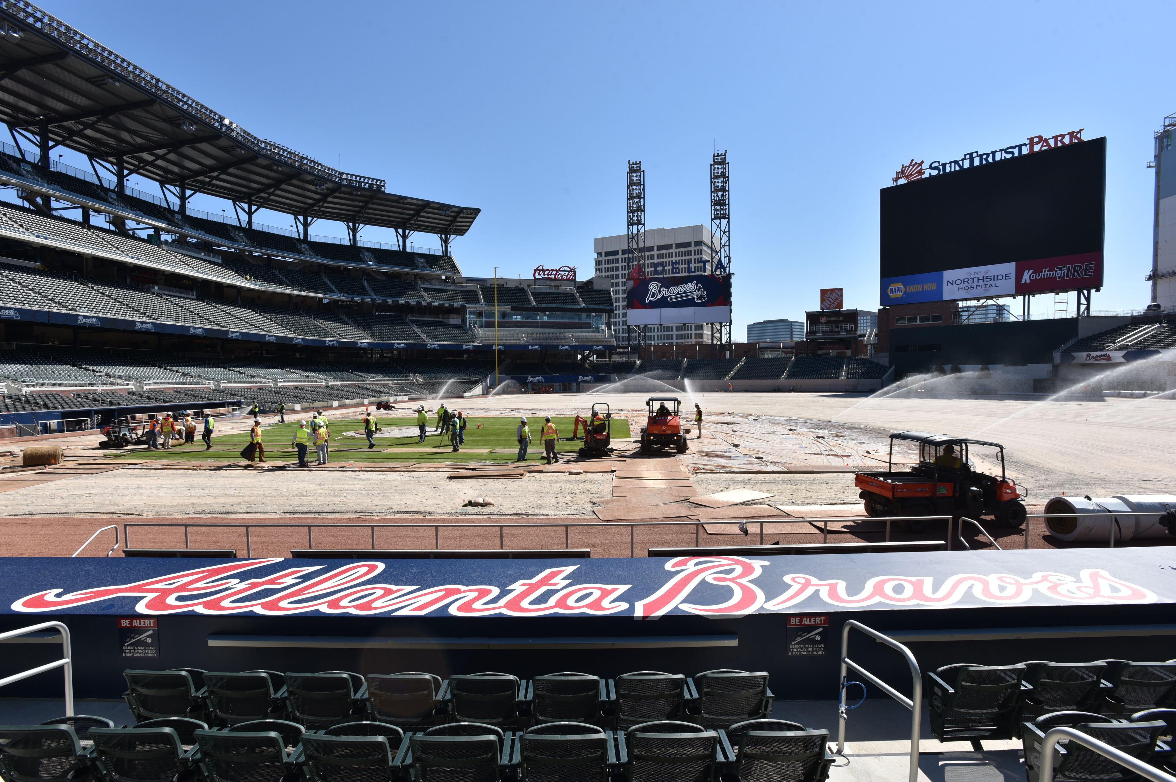 March 4, 2017 Atlanta - Workers install sod in the infield at SunTrust Park on Saturday, March 4, 2017. The Braves marked an important milestone in the construction of SunTrust Park on Saturday. Workers began the installation of 109,000 square feet of sod on the field, a task that will continue Sunday. The Braves selected a type of grass called âSeashore Paspalum, Platinum TEâ for the stadium, according to field director Ed Mangan. HYOSUB SHIN / HSHIN@AJC.COM