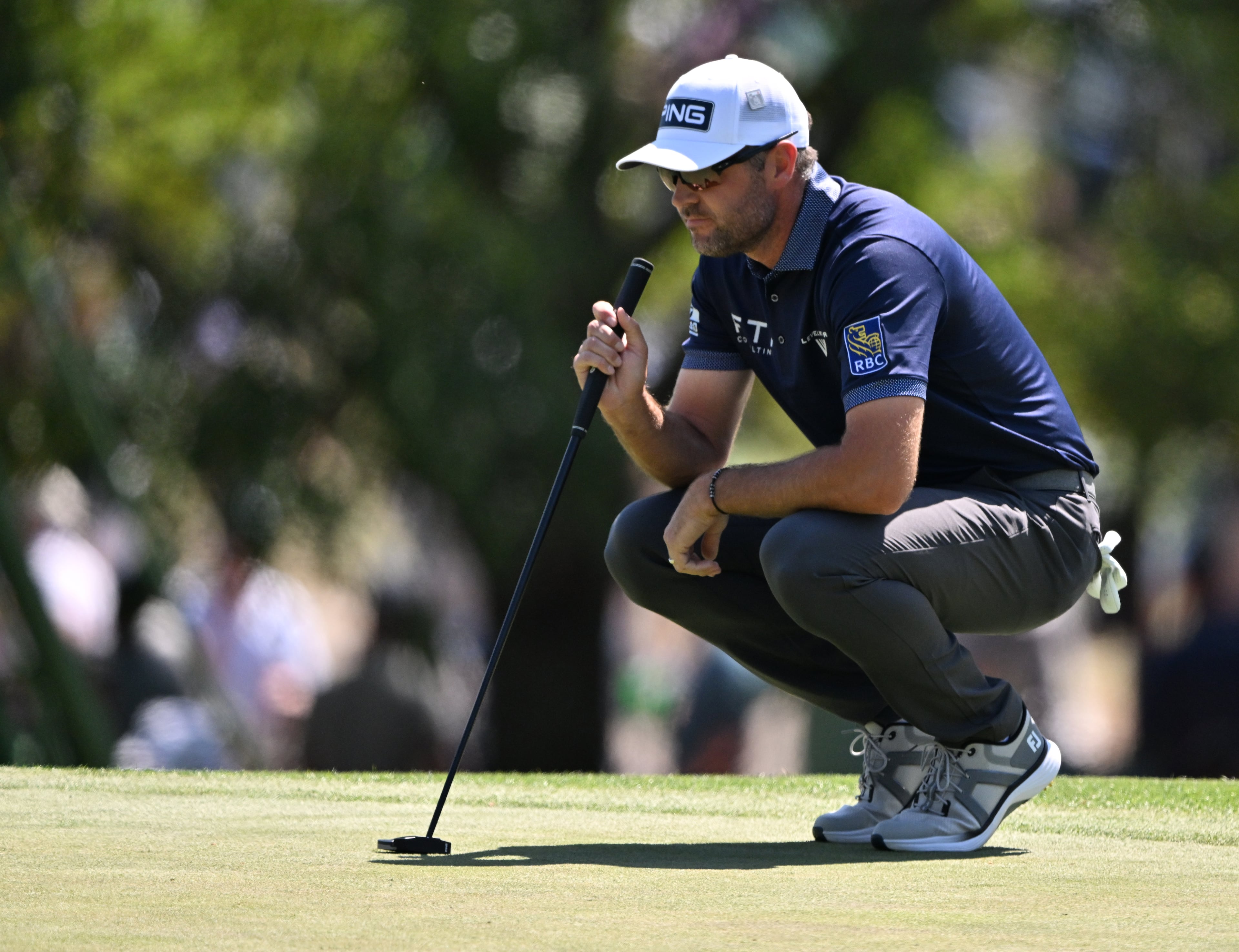 Corey Conners lines up putt on third hole during final round of the Masters golf tournament, at Augusta National Golf Club, Saturday, April 13, 2025, in Augusta, Ga. (Hyosub Shin / AJC)