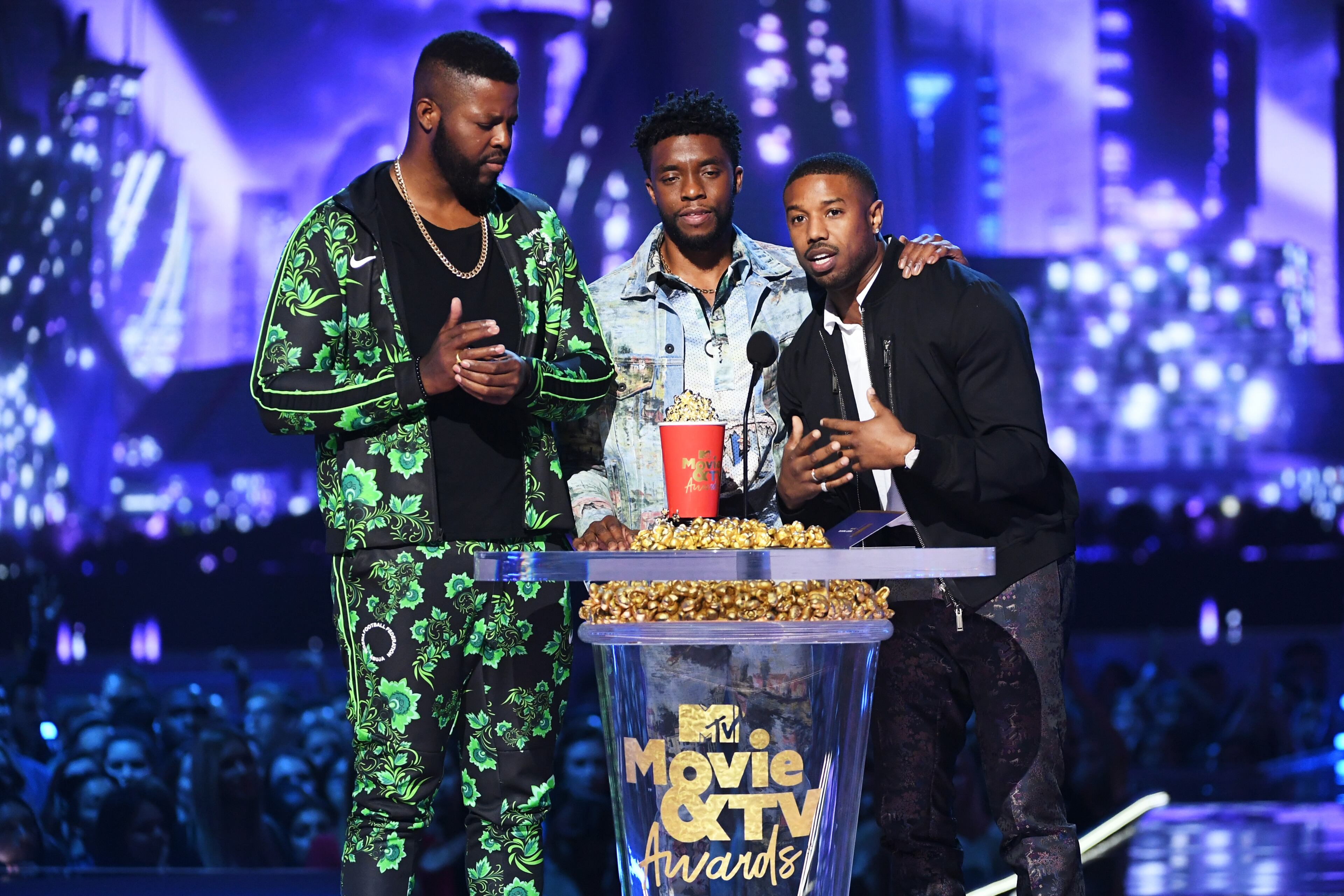 SANTA MONICA, CA - JUNE 16: (L-R) Actors Winston Duke, Chadwick Boseman, and Michael B. Jordan accept the Best Movie award (Presented by Toyota) for 'Black Panther' onstage during the 2018 MTV Movie And TV Awards at Barker Hangar on June 16, 2018 in Santa Monica, California. (Photo by Kevin Winter/Getty Images for MTV)