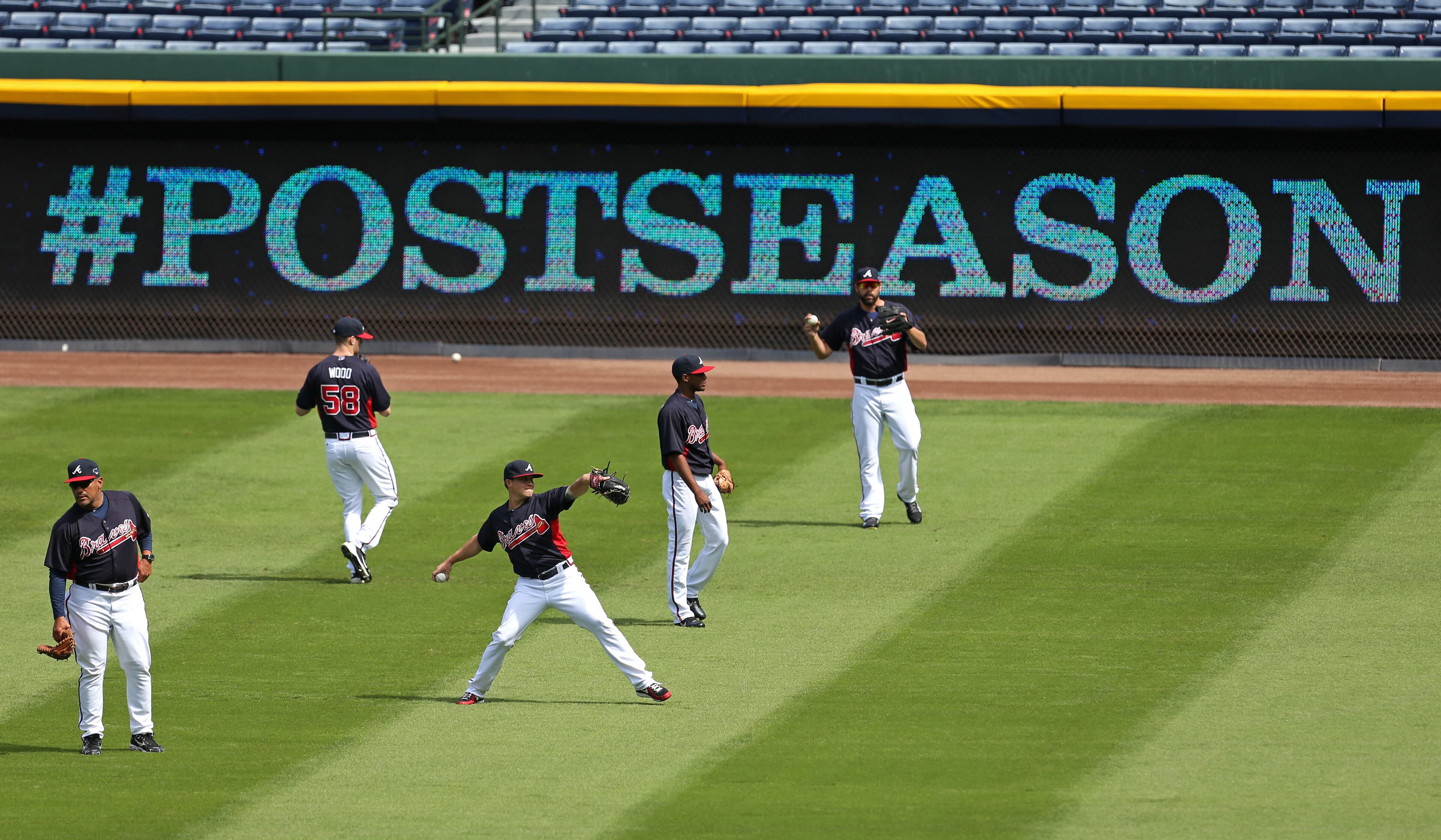 Atlanta Braves starting pitcher Kris Medlen, center, throws with fellow pitchers in preparation for their NL Division Series against the Los Angeles Dodgers at Turner Field in Atlanta, Ga., October 2, 2013. The Atlanta Braves host the Los Angeles Dodgers in game 1 of the NL Division Series Thursday October 3, 2013 at 8:37pm. Medlen is the Braves starting pitcher for game 1 of the series.