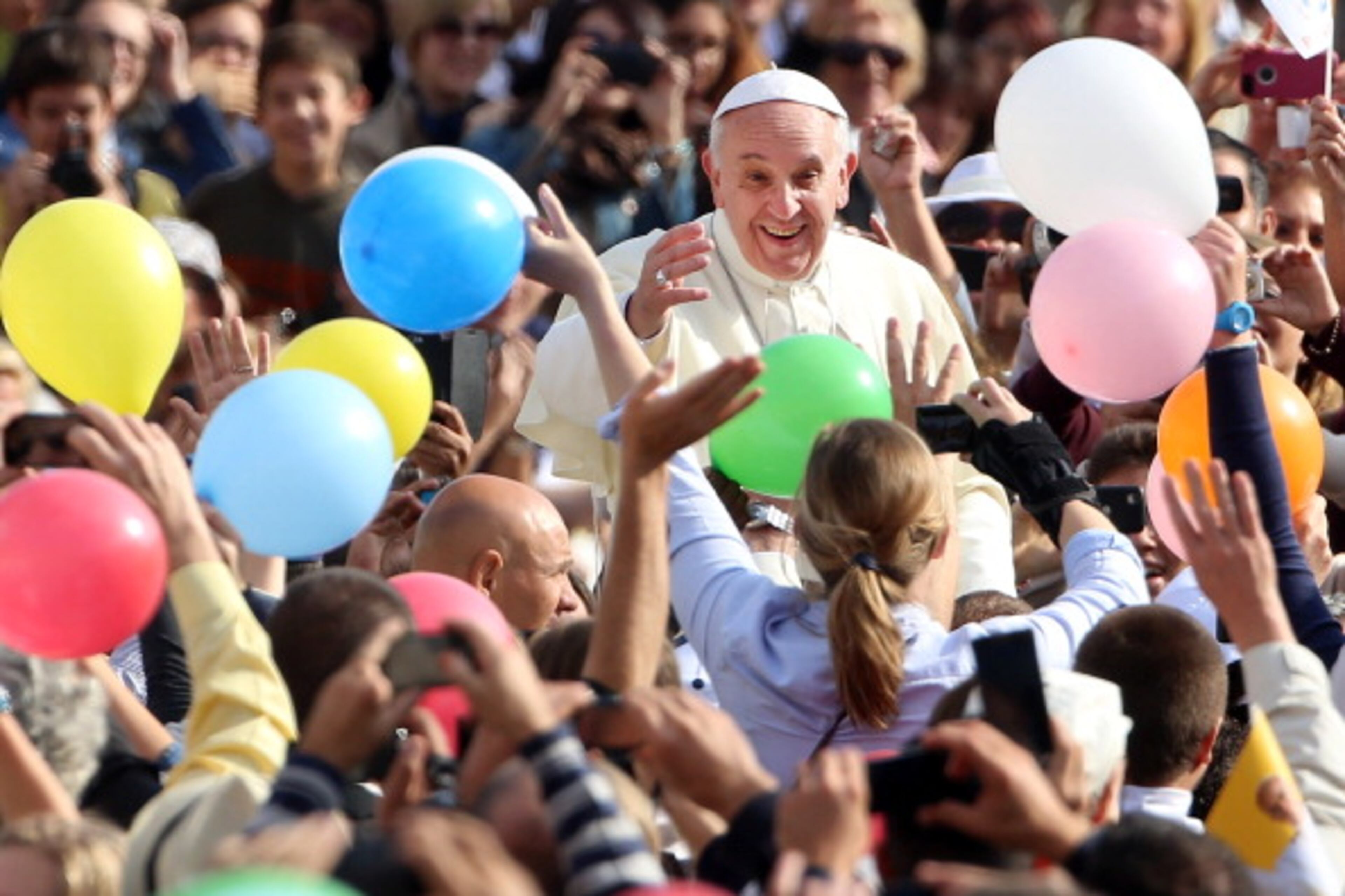 ROME, ITALY - OCTOBER 30: Pope Francis waves to the faithful as he arrives in the popemobile at St. Peter's Square for his weekly audience on October 30, 2013 in Rome, Italy. During the audience the pontiff continued his series of catechetical reflections on the Creed, focusing this week on the Communion of Saints. (Photo by Franco Origlia/Getty Images)
