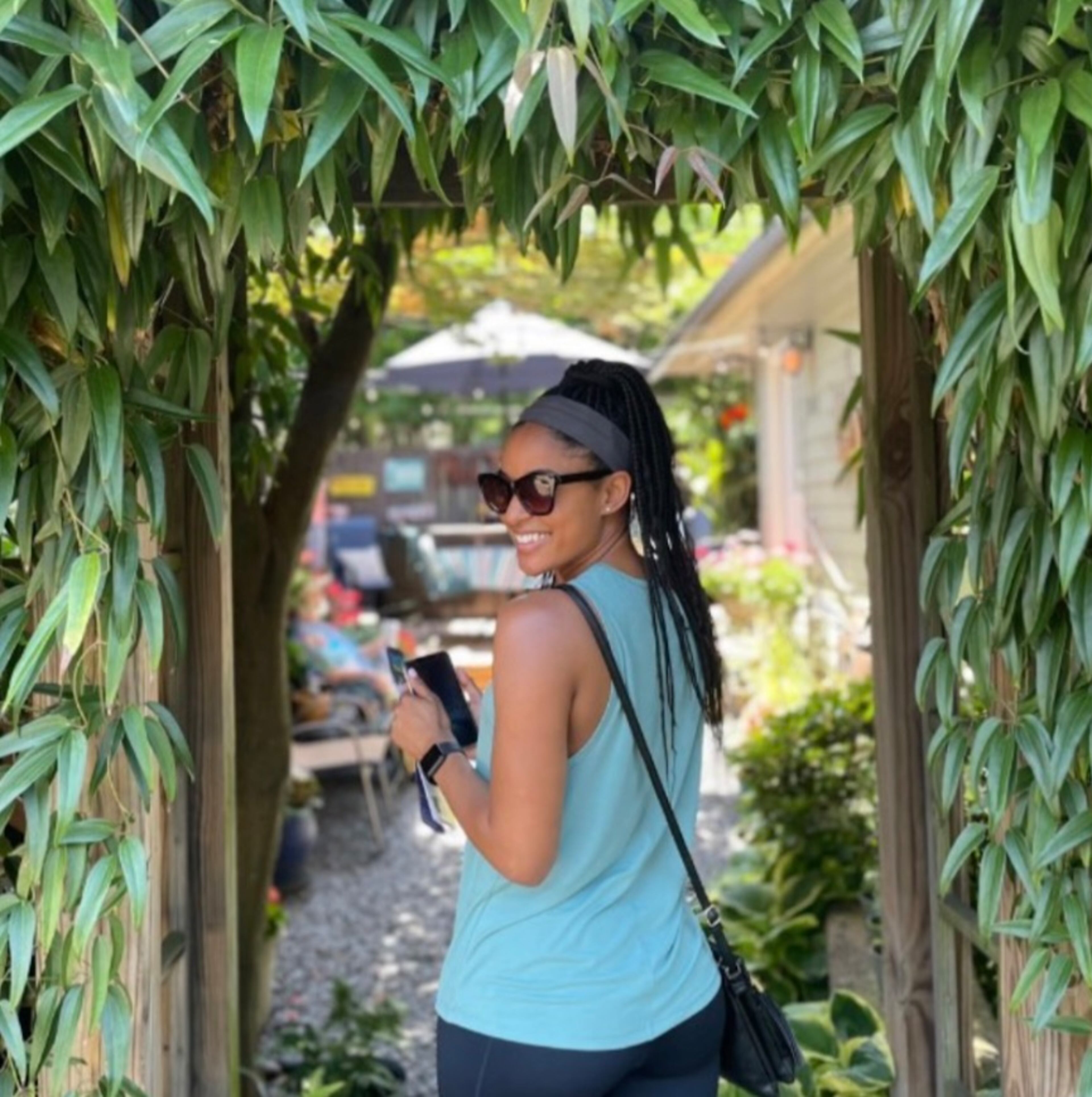A garden tour guest gets ready to see what’s behind the doors in Midtown during the Midtown Neighbors Association's Garden Stroll.
(Courtesy of the Midtown Garden Stroll)