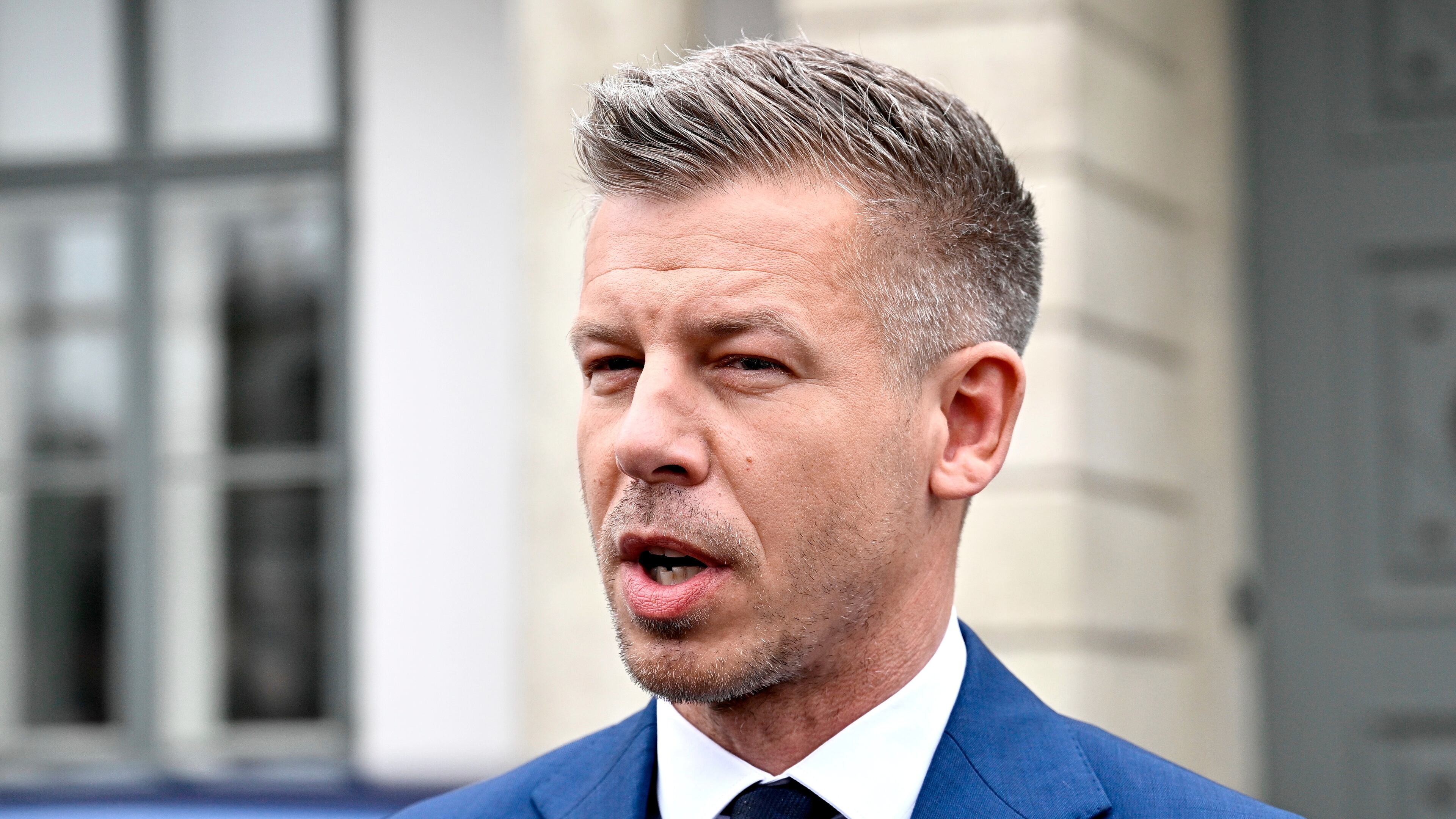 Peter Magyar, leader of the election-winning Tisza Party, talks to the media before meeting Hungarian President Tamas Sulyok in the presidential Alexander Palace in Budapest, Hungary, Wednesday April 15, 2026. (Robert Hegedus/MTI via AP)