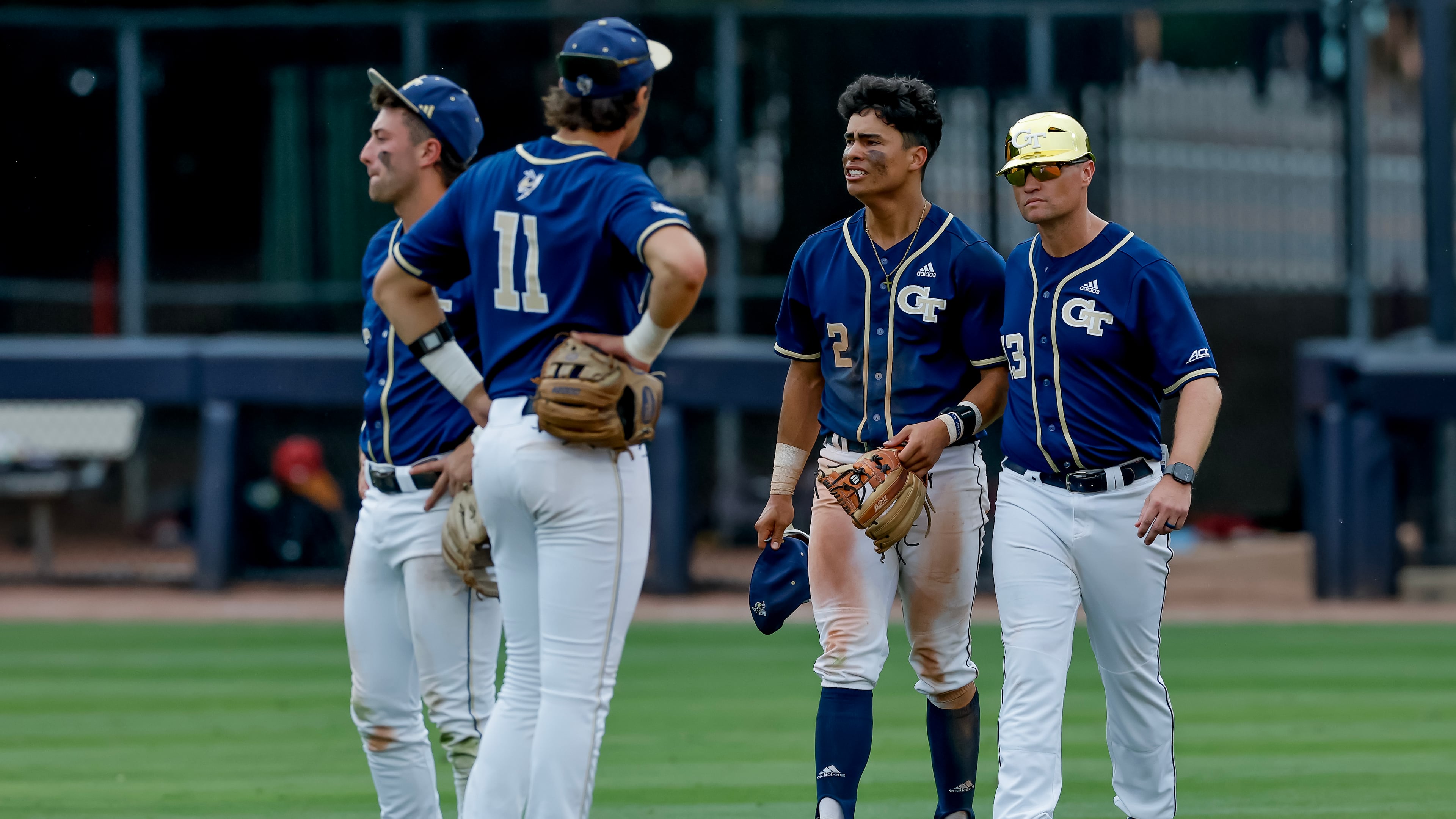Georgia Tech head coach James Ramsey, right, consoles Jarren Advincula (2), Ryan Zuckerman (11) and Carson Kerce (3), after Oklahoma hit a solo home run against Tech during the 10th inning to win the NCAA D1 Atlanta Regional elimination baseball game at Russ Chandler Stadium, Monday, June 1, 2026, in Atlanta. (Erik S. Lesser for the AJC)