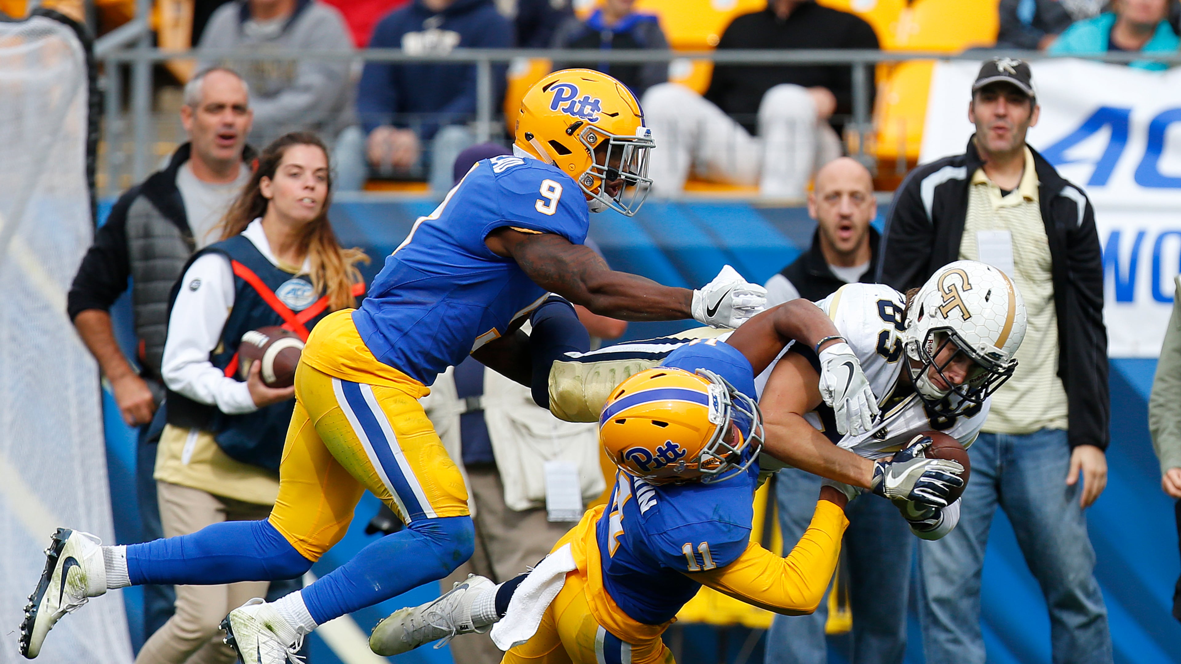 Brad Stewart #83 of the Georgia Tech Yellow Jackets pulls in the pass against Dane Jackson #11 and Jordan Whitehead #9 of the Pittsburgh Panthers in the second half on October 8, 2016 at Heinz Field in Pittsburgh, Pennsylvania. (Photo by Justin K. Aller/Getty Images)