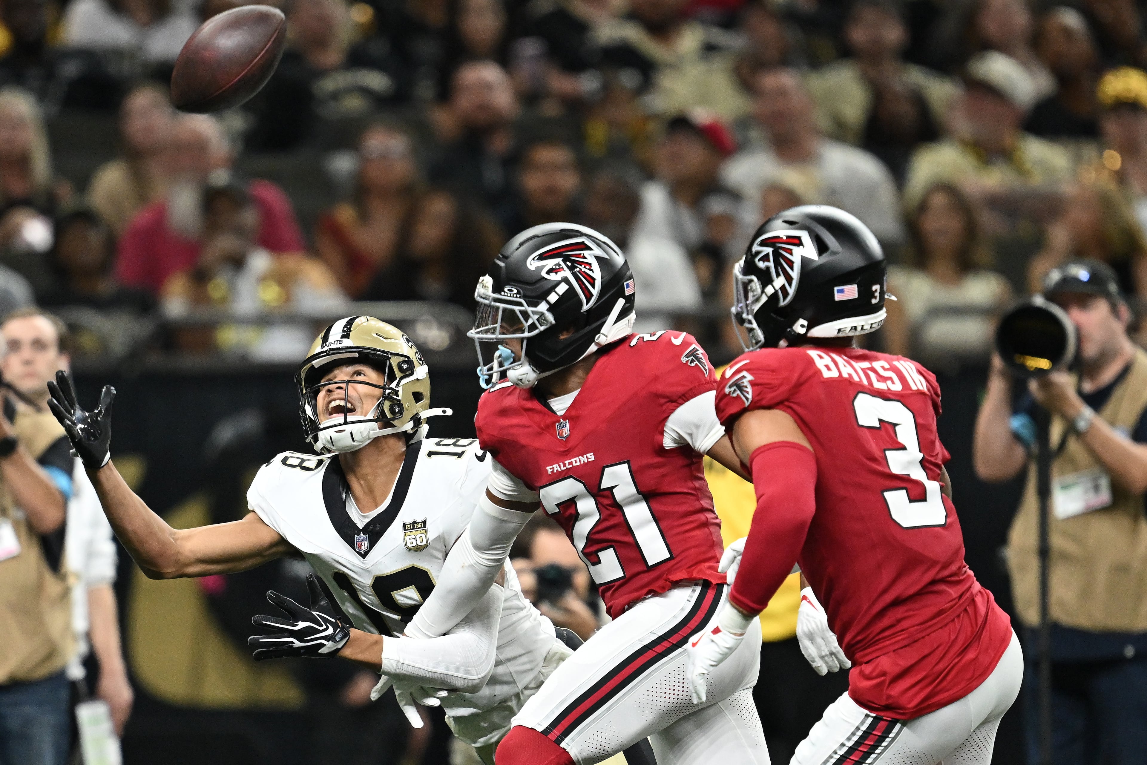 New Orleans Saints wide receiver Bryce Lance (left) cannot catch a pass while being defended by Atlanta Falcons cornerback Mike Hughes (center) and free safety Jessie Bates III (right) during the second half of an NFL football game in New Orleans, Monday, Oct. 5, 2026. (Ella Hall/AP)