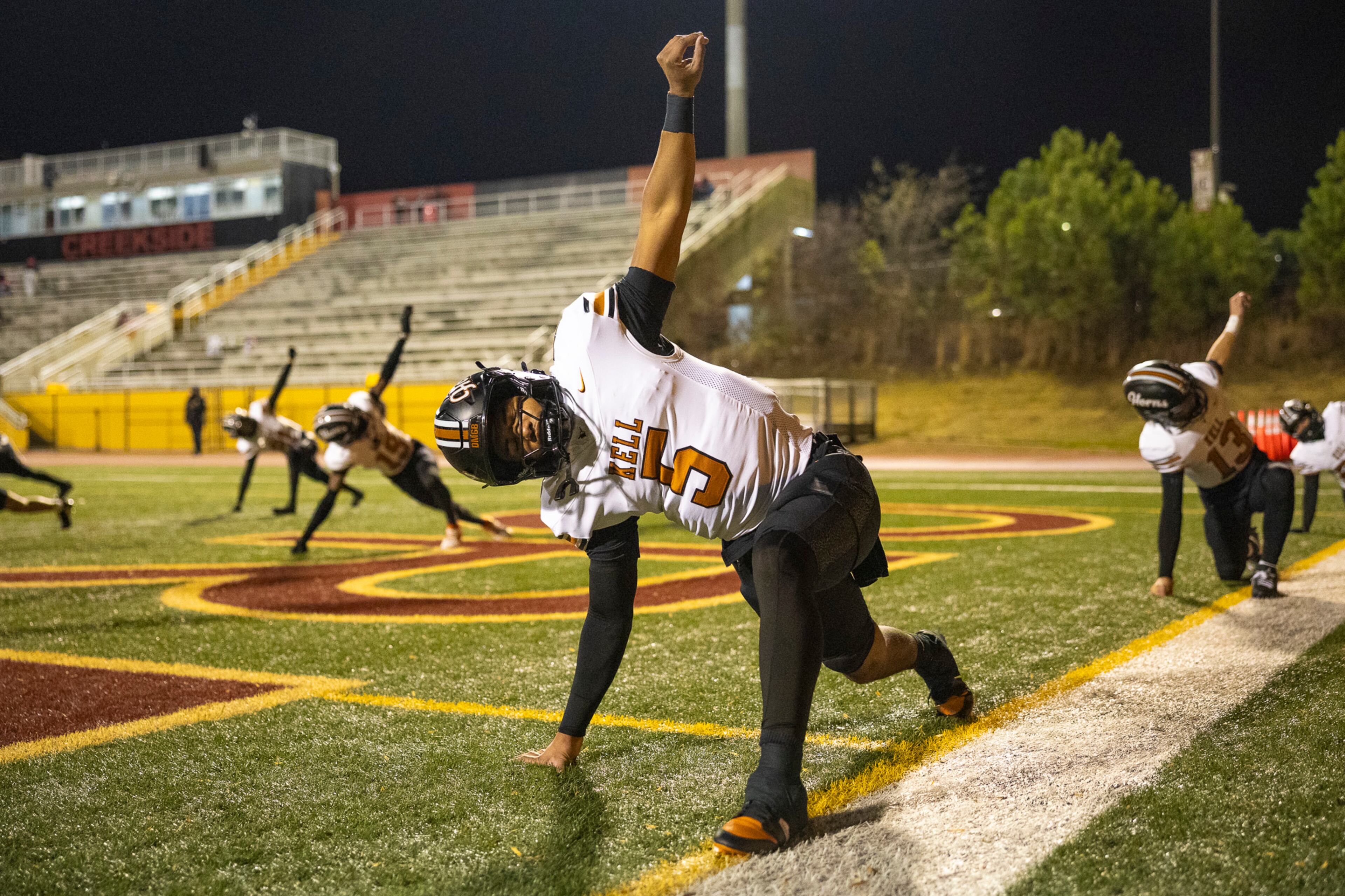 Kell quarterback Kaleb Narcisse stretches during warmups before the Class 4A semifinal against Creekside on Friday, Dec. 5, 2025, at Creekside High School in Fairburn. (Oscar Guevara Saenz for the AJC)