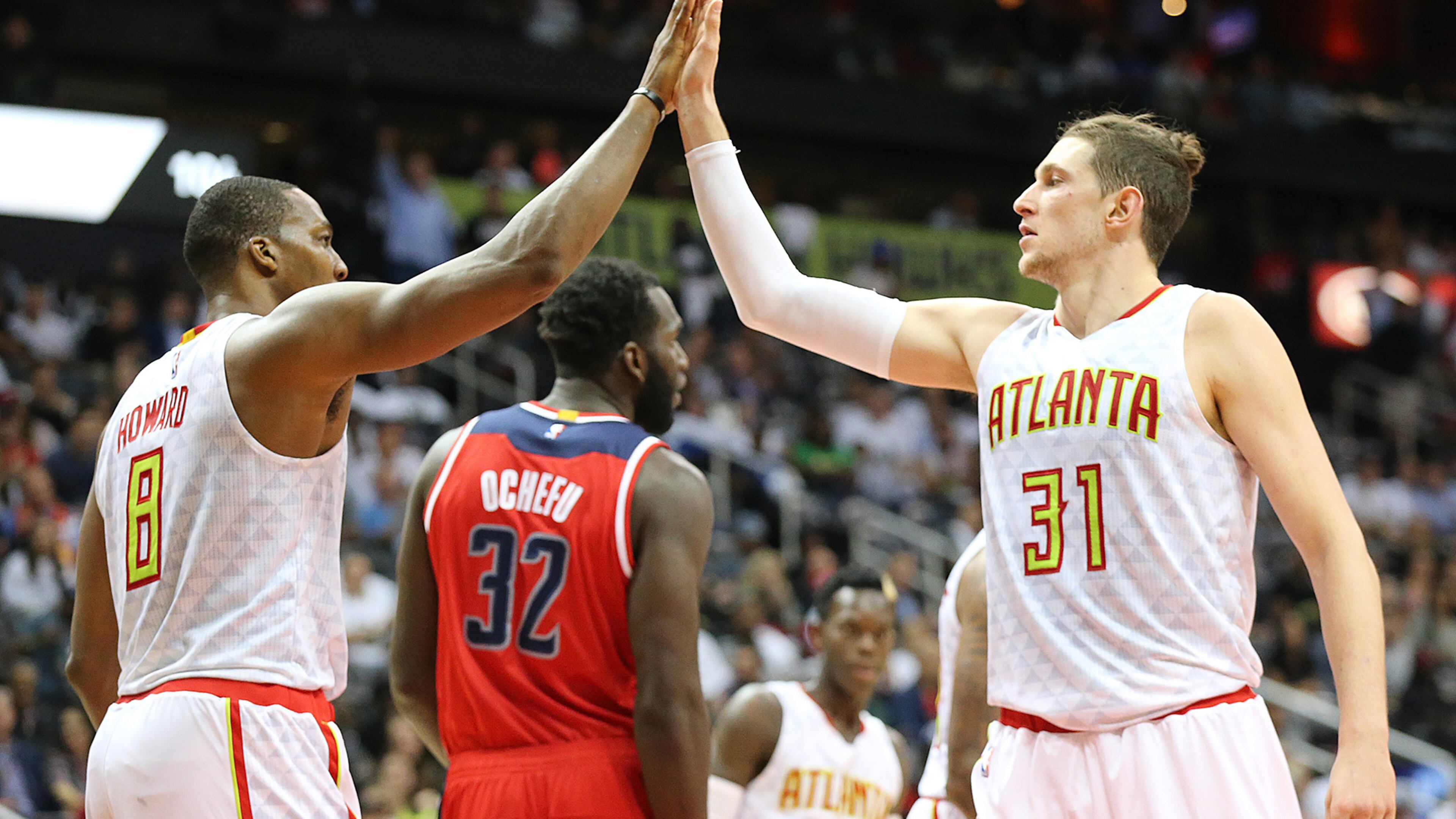 Hawks’ Mike Muscala gets five from Dwight Howard after a play against the Wizards during the fourth period of their NBA basketball game at Philips Arena on Thursday, Oct. 27, 2016, in Atlanta. Curtis Compton /ccompton@ajc.com