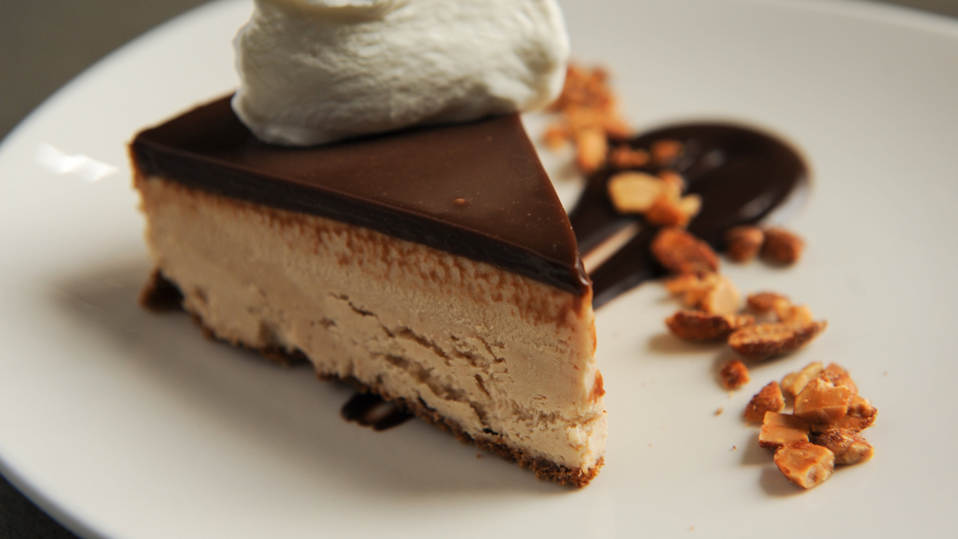 Peanut butter pie with graham cracker crust, candied peanuts and whipped cream at Common Quarter in Marietta. (BECKY STEIN)