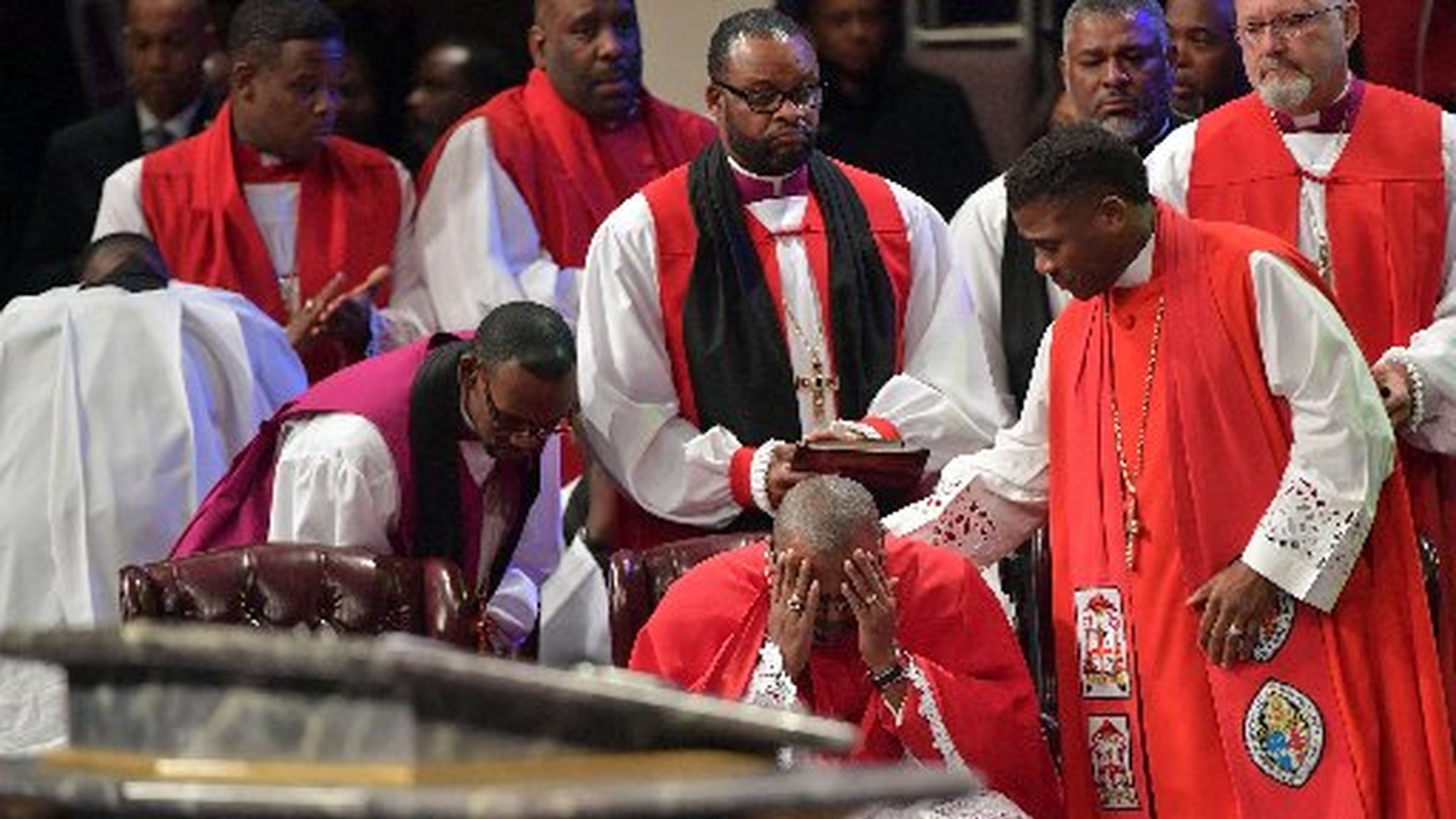 The Most Rev. Neil C. Ellis becomes emotional Wednesday after delivering the eulogy during funeral services for Bishop Eddie Long, senior pastor, at New Birth Missionary Baptist Church in Lithonia. More than 10,000 turned out to celebrate and honor the late pastor, who died at age 63. HYOSUB SHIN / HSHIN@AJC.COM