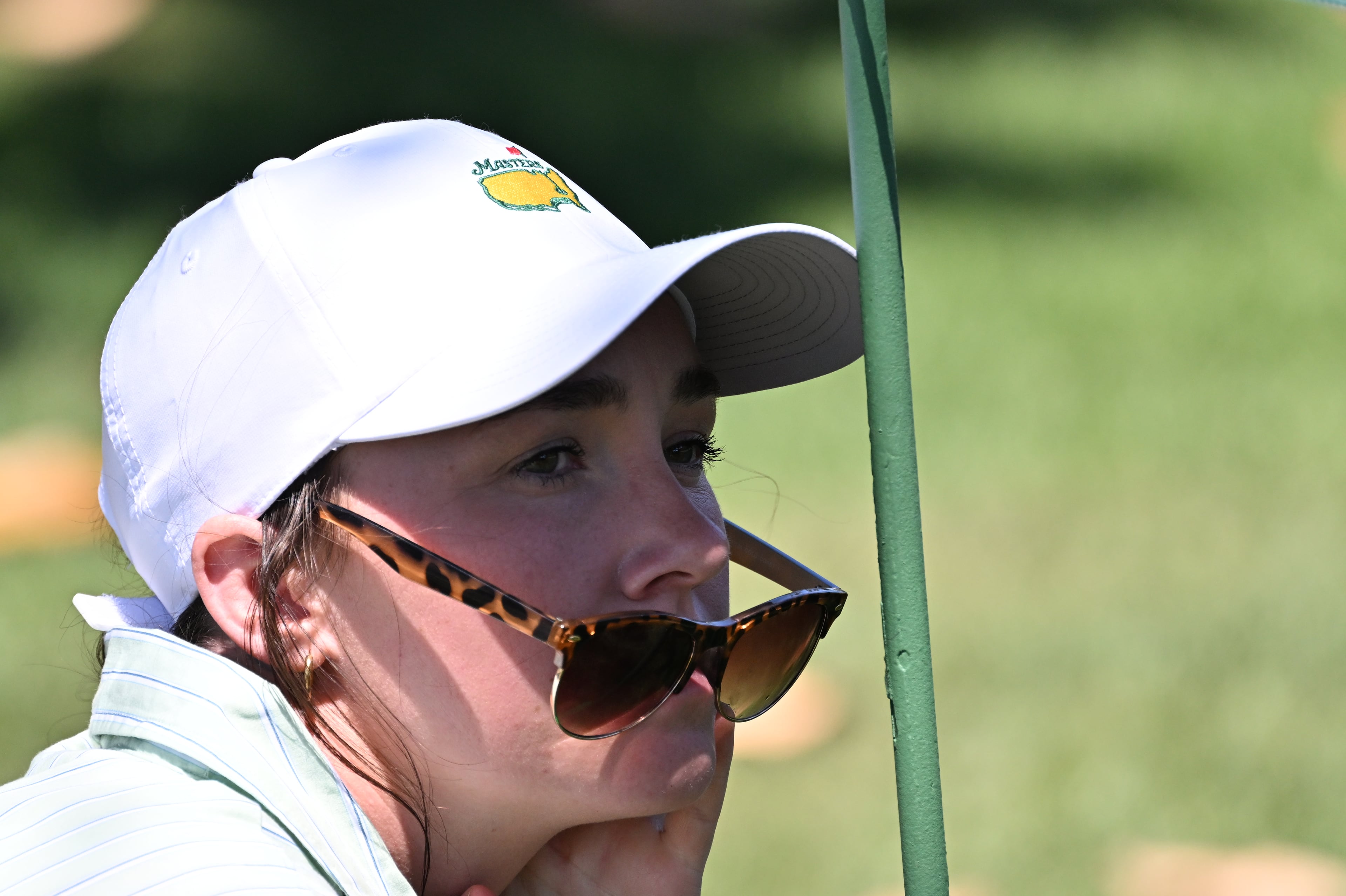 A patron waits for players to come through on the first fairway during the final round of the Masters at Augusta National, Sunday, April 12, 2026, in Augusta, Ga. (Hyosub Shin/AJC)