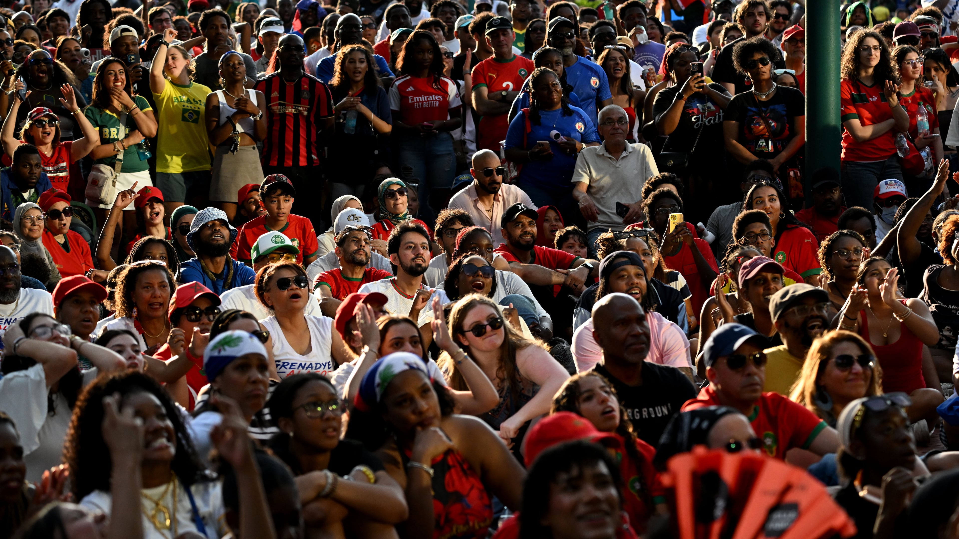 Soccer fans gather to watch the World Cup match between Morocco and Haiti at the FIFA Fan Festival in Centennial Olympic Park on Wednesday, June 24, 2026, in Atlanta. High temperatures on Saturday are expected to reach 92 degrees, according to the National Weather Service. (Hyosub Shin/AJC)