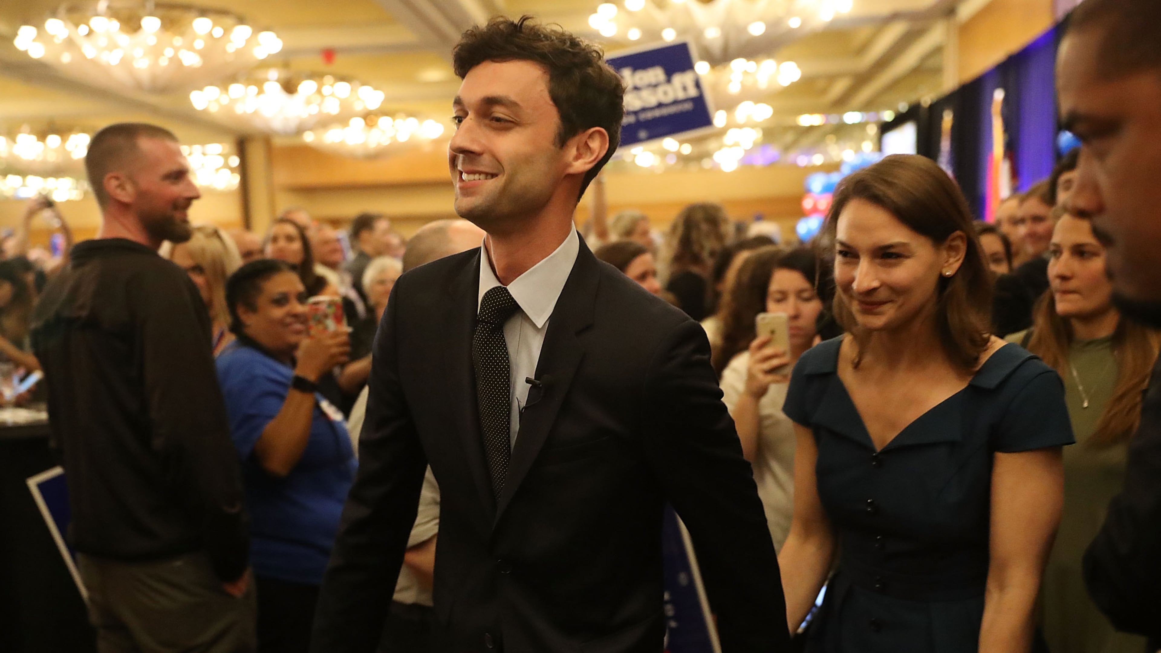ATLANTA, GA - APRIL 18: Democratic candidate Jon Ossoff walks with his girlfriend Alisha Kramer after speaking to his supporters as votes continue to be counted in a race that was too close to call for Georgia's 6th Congressional District in a special election to replace Tom Price, who is now the secretary of Health and Human Services on April 18, 2017 in Atlanta, Georgia. The winner of the race would fill a congressional seat that has been held by a Republican since the 1970s. (Photo by Joe Raedle/Getty Images)