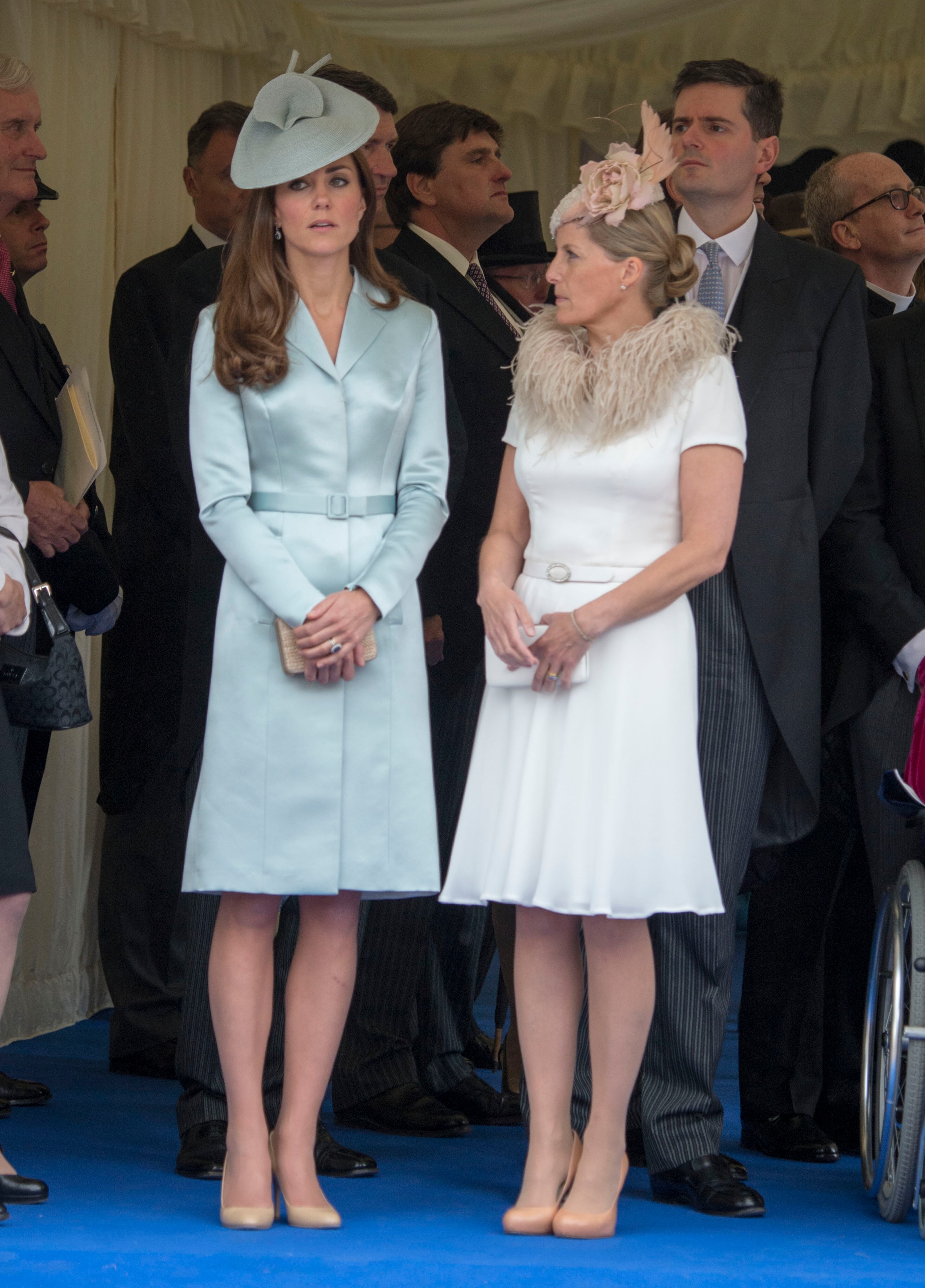Britain's Kate, Duchess of Cambridge and Sophie, Countess of Wessex, watch the annual procession for members of the Order of the Garter ahead of the service at St George's Chapel, Windsor Castle, England Monday June 16, 2014. (AP Photo/Arthur Edwards, Pool)