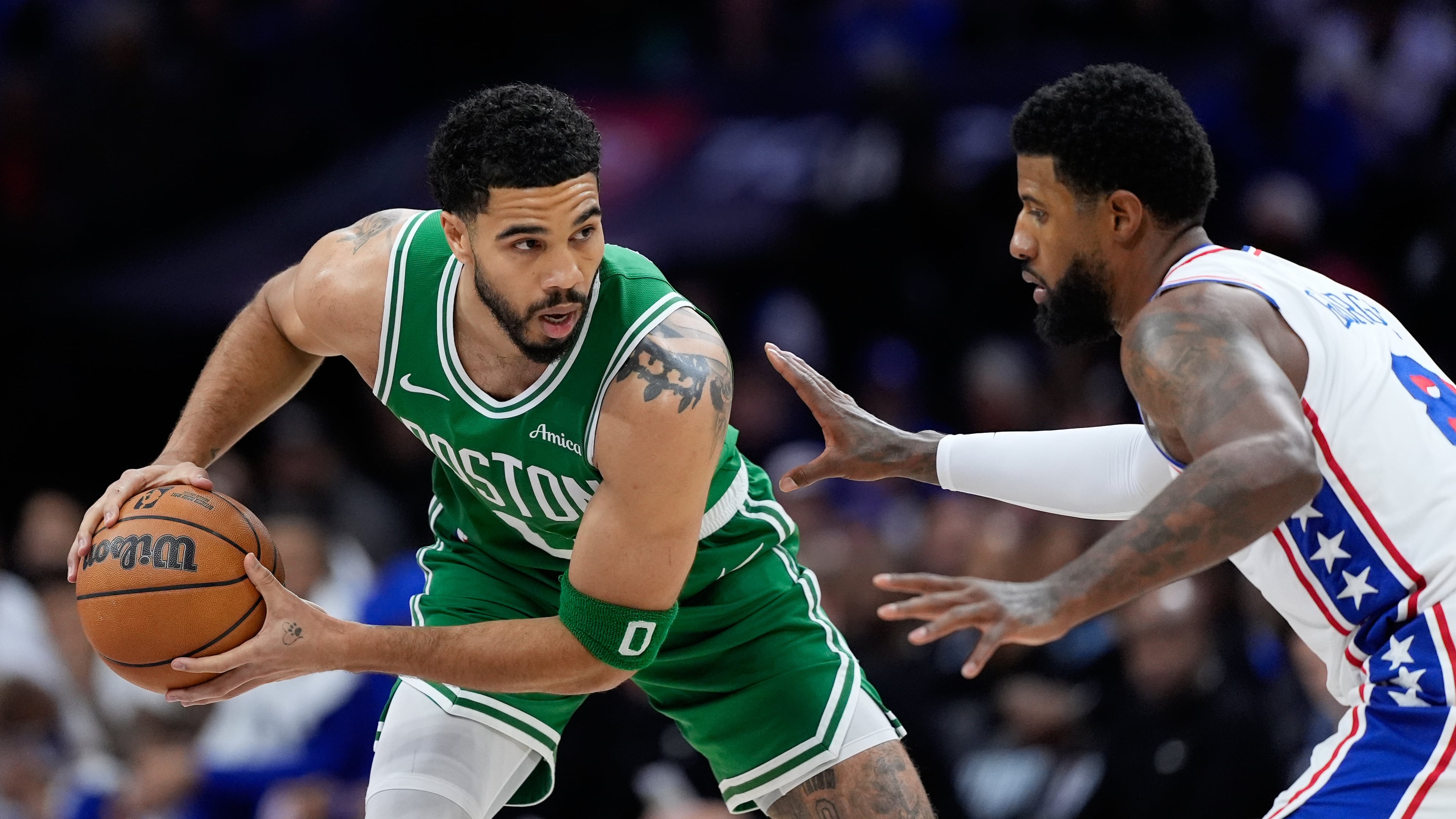 Boston Celtics' Jayson Tatum, left, tries to get past Philadelphia 76ers' Paul George during the first half of Game 6 in a first-round NBA basketball playoff series Thursday, April 30, 2026, in Philadelphia. (AP Photo/Matt Slocum)