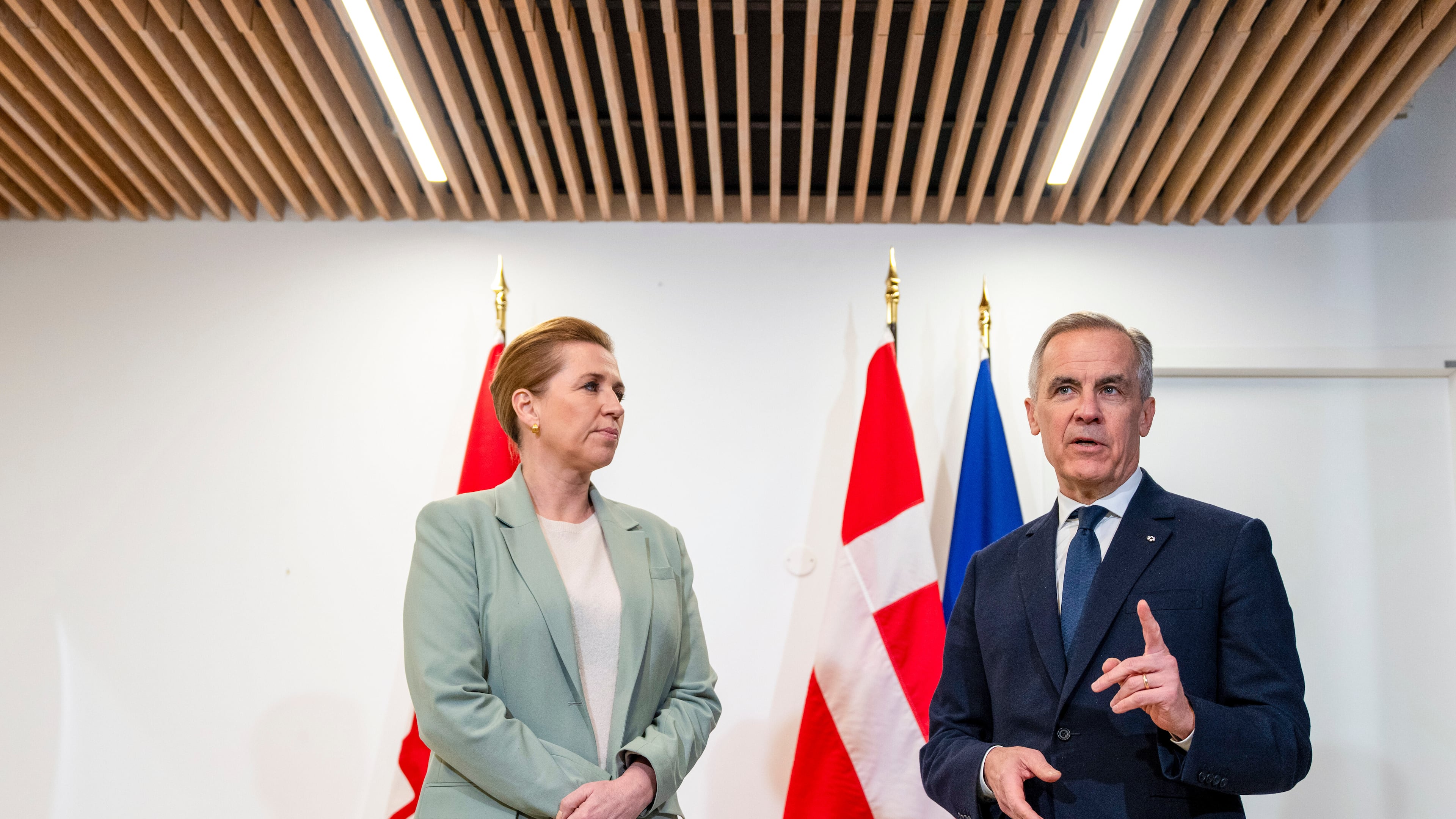 Canadian Prime Minister Mark Carney, right, takes part in a bilateral meeting with Prime Minister of Denmark Mette Frederiksen, at the Canadian Embassy in Paris, France, Tuesday, Jan. 6, 2026. (Christinne Muschi/The Canadian Press via AP)