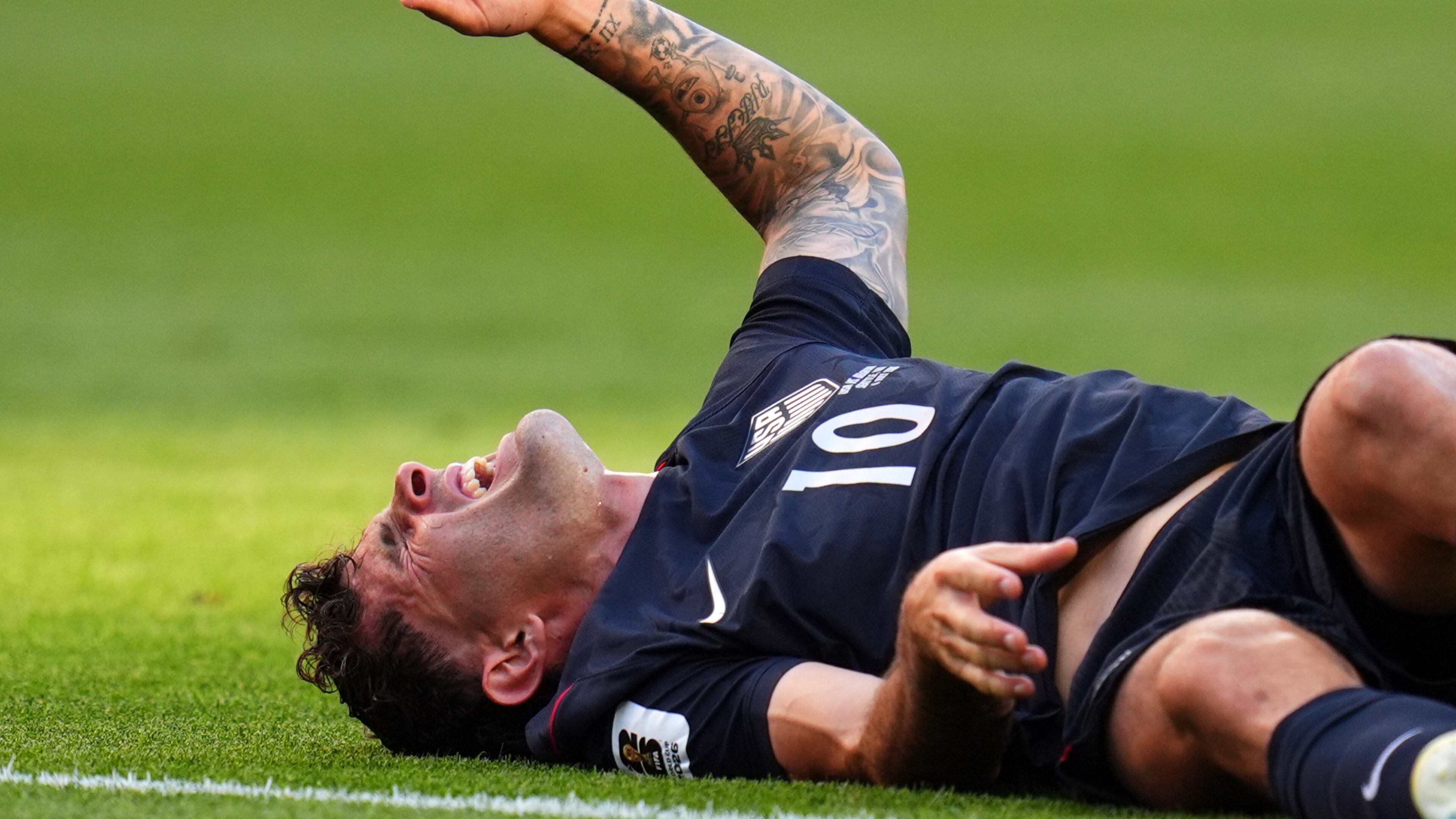 United States' Christian Pulisic (10) reacts after a challenge during the World Cup round of 16 soccer match in Seattle, Monday, July 6, 2026. (AP Photo/Manu Fernandez)