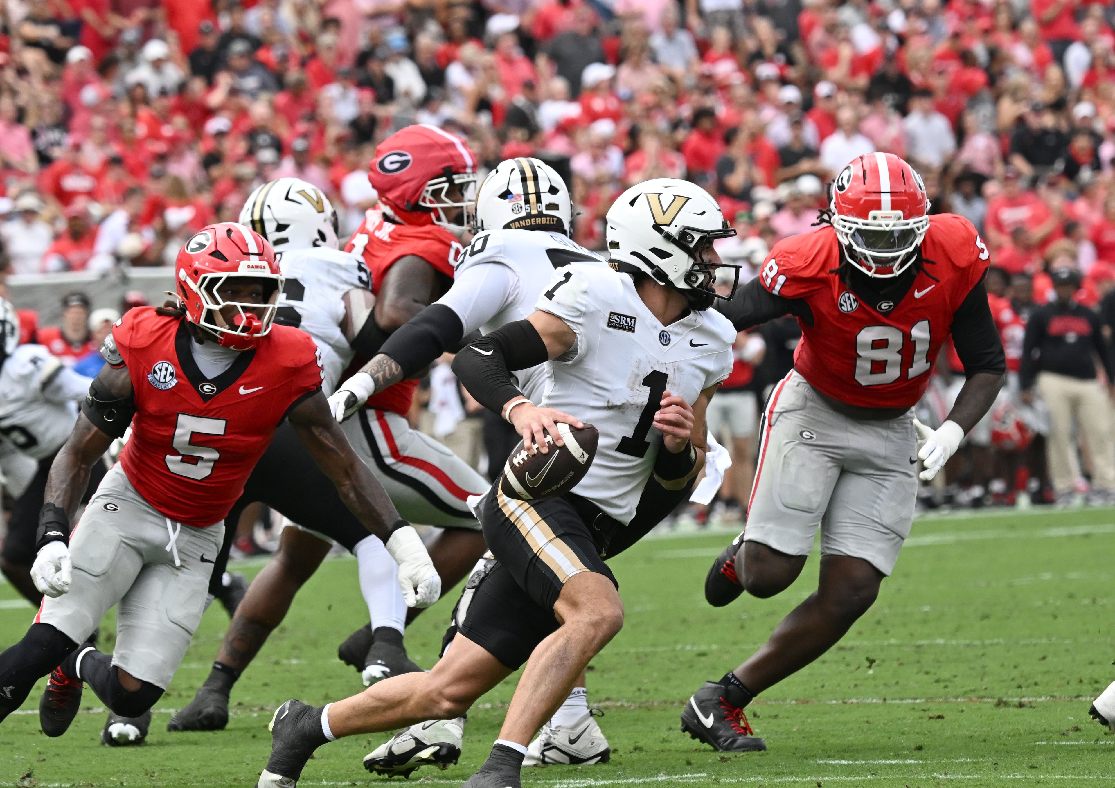 Vanderbilt quarterback Blaze Berlowitz (1) prepares to get off a pass during the first half in an NCAA football game at Sanford Stadium on Saturday, Oct. 3, 2026, in Athens. (Hyosub Shin/AJC)