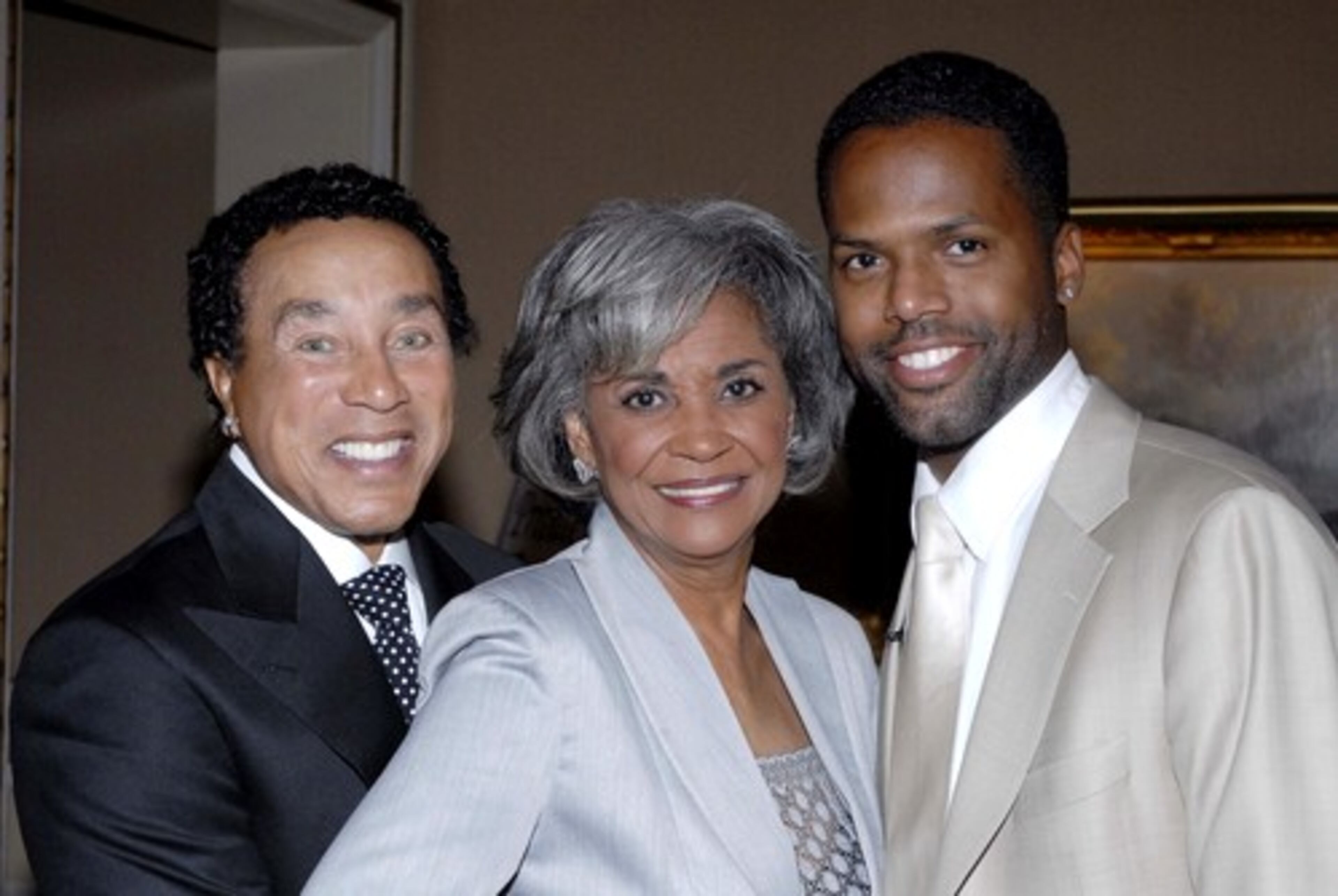 Musician Smokey Robinson (left) smiles with Nancy Wilson and A.J. Calloway (formerly of BET's '106 & Park.'