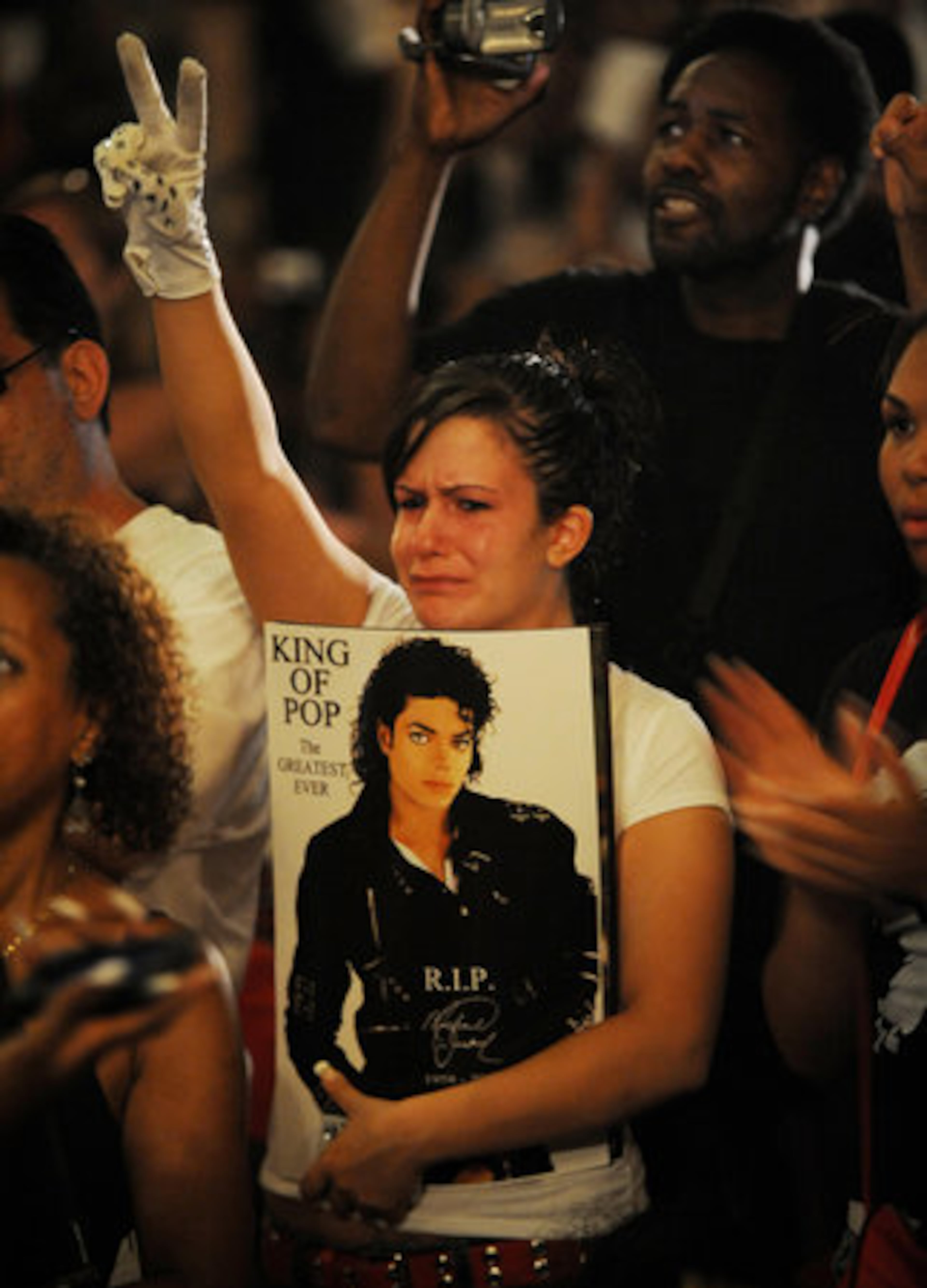 The King of Pop. The Greatest Ever. R.I.P. The Apollo tribute was festive and upbeat throughout the day but many fans showed more solemn emotions.