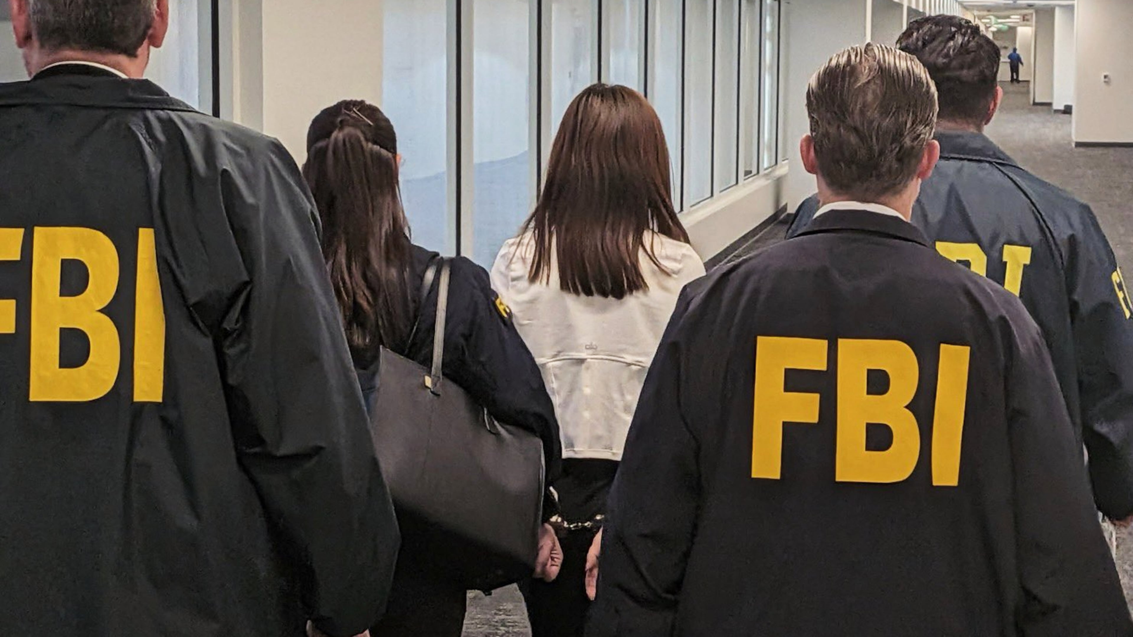 This photo provided by the Federal Bureau of Investigation shows Wanying Zhang being arrested Sunday, Oct. 4, 2026, in Los Angeles. (Federal Bureau of Investigation via AP)