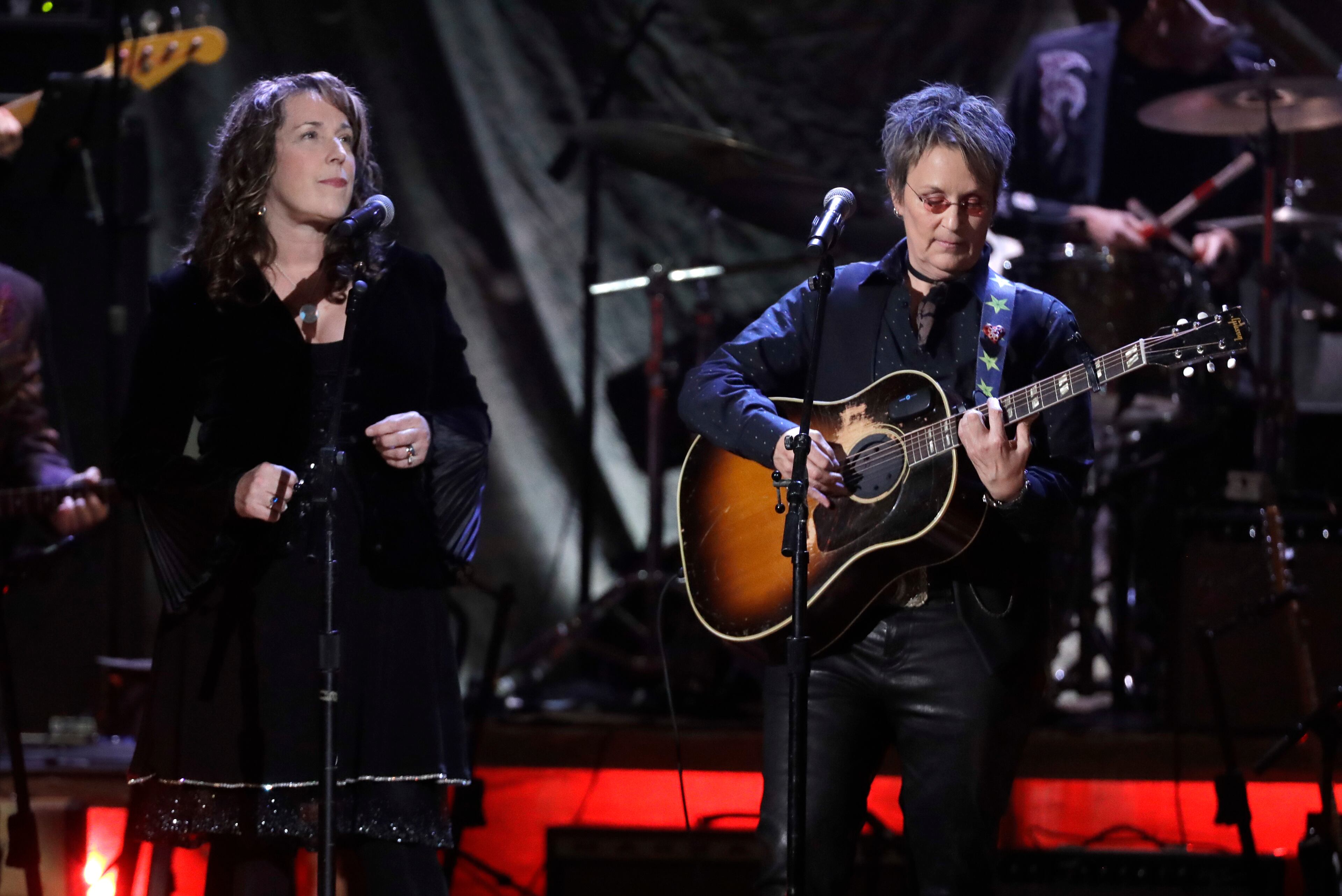 Beth Nielsen Chapman, left, and Mary Gauthier perform during the Americana Honors and Awards show Wednesday, Sept. 12, 2018, in Nashville, Tennessee. (AP Photo/Mark Zaleski)