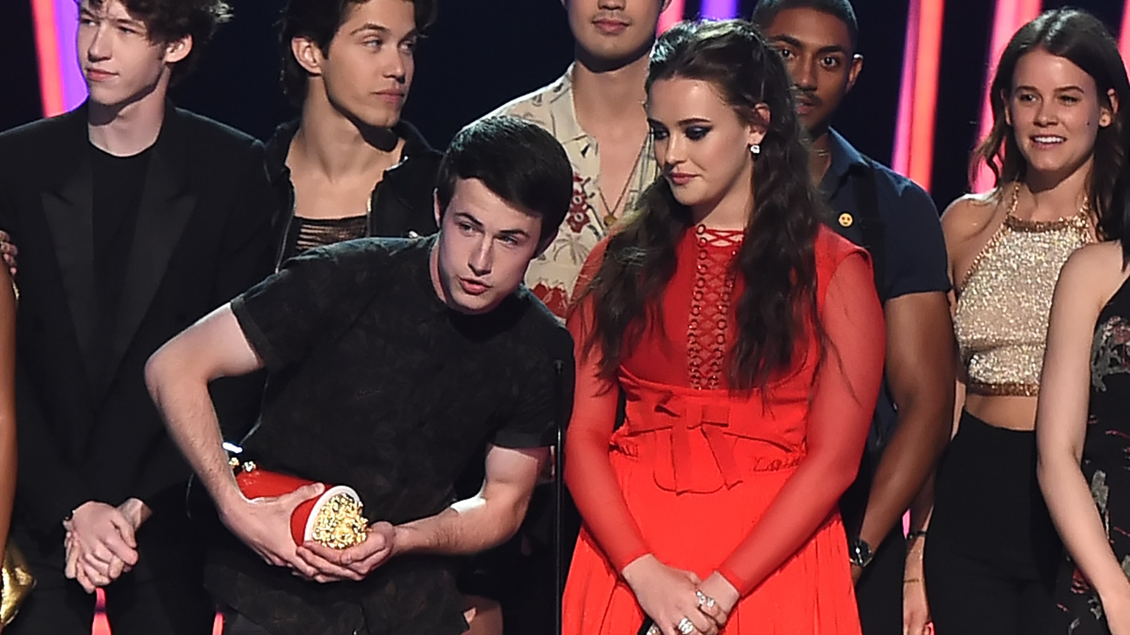 LOS ANGELES, CA - MAY 07: Actors Dylan Minnette (L) and Katherine Langford with the cast of '13 Reasons Why' speak onstage during the 2017 MTV Movie And TV Awards at The Shrine Auditorium on May 7, 2017 in Los Angeles, California. (Photo by Kevin Winter/Getty Images)