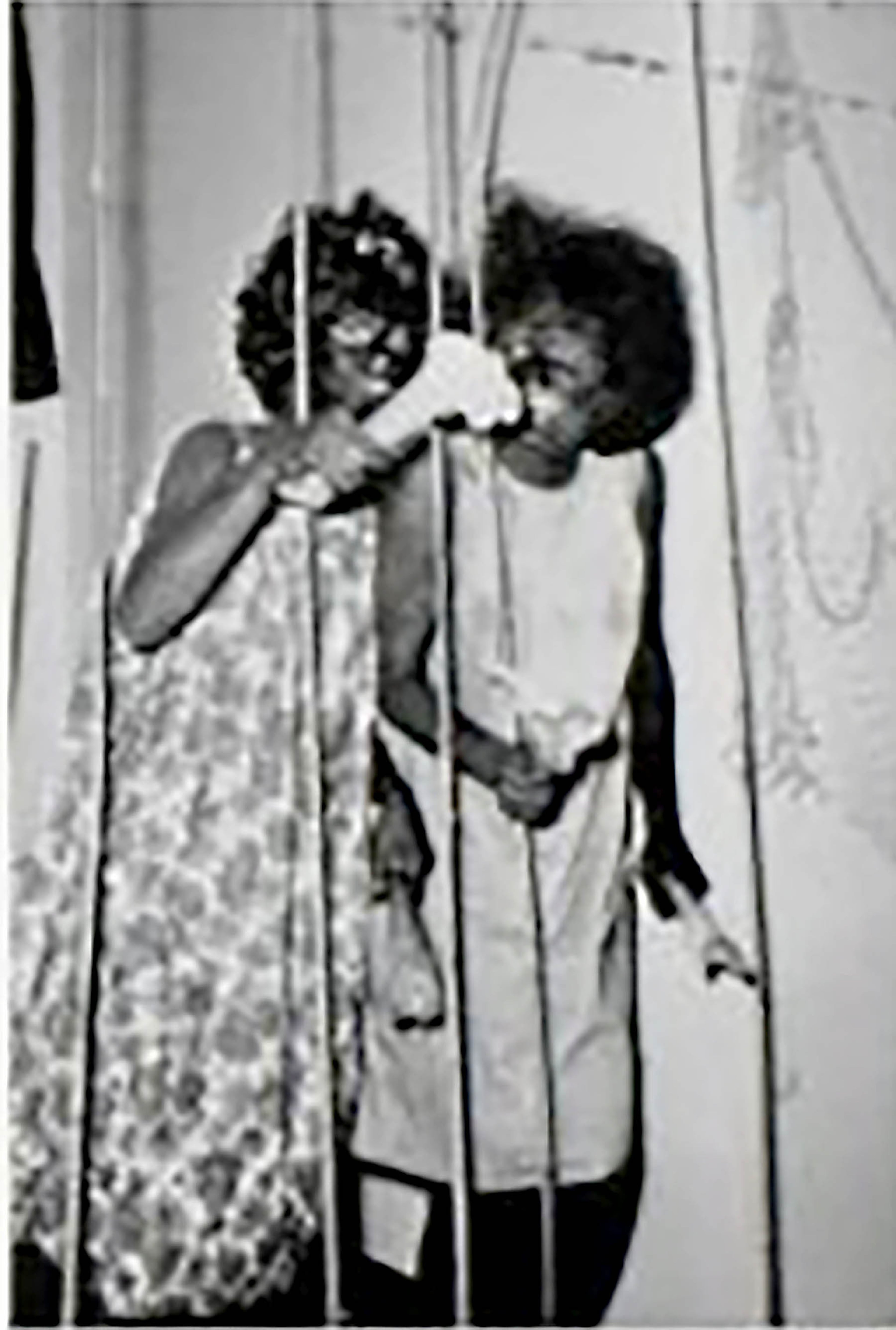 Mercer University yearbook, 1964, sorority sisters are in blackface behind bars with "It's Saturday night," in caption.