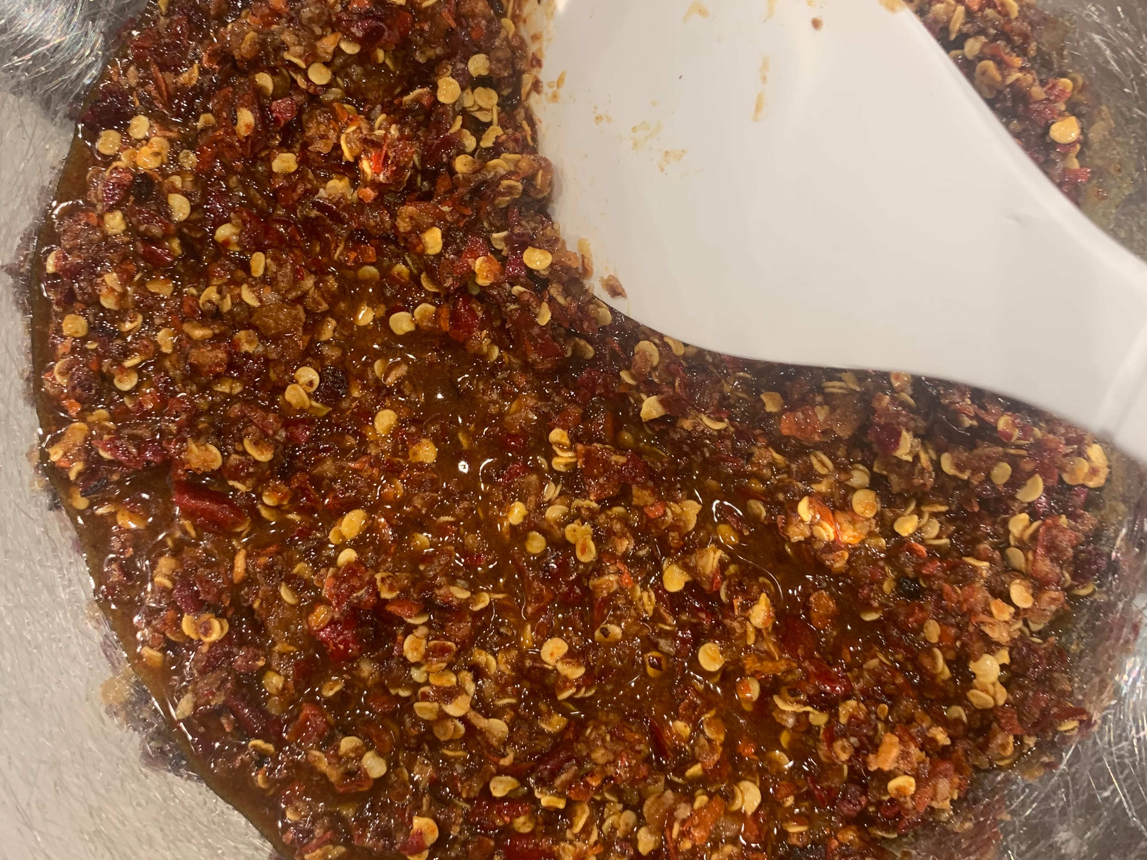 Here, Spicy Chili Crisp is being prepared. John Kessler for The AJC