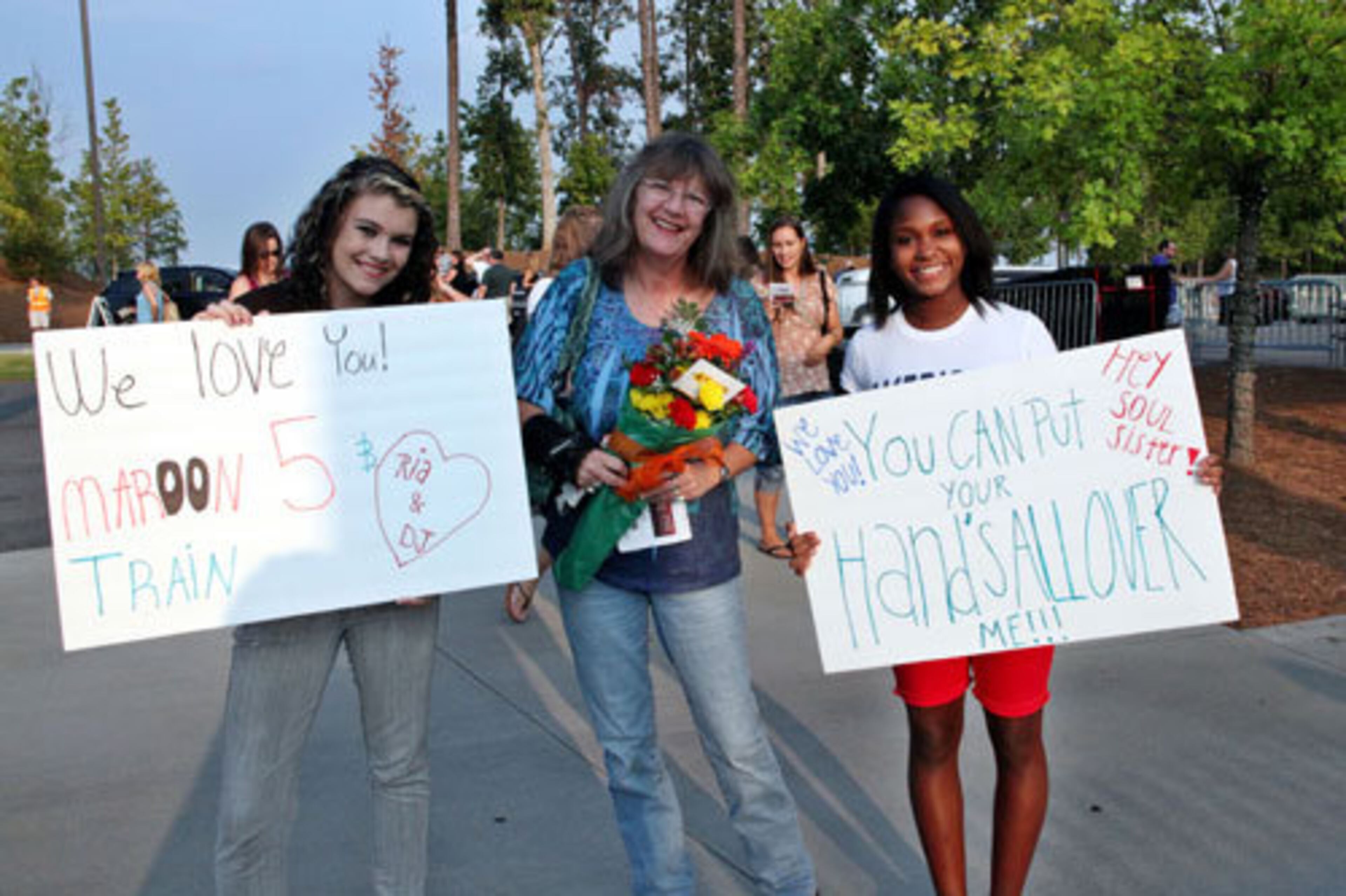 D.J. Hellman, Kim Butler and Ria Brown drove in from Douglasville to see their favorite bands Thursday night in Alpharetta at the Verizon Wireless Amphitheatre at Encore Park.
