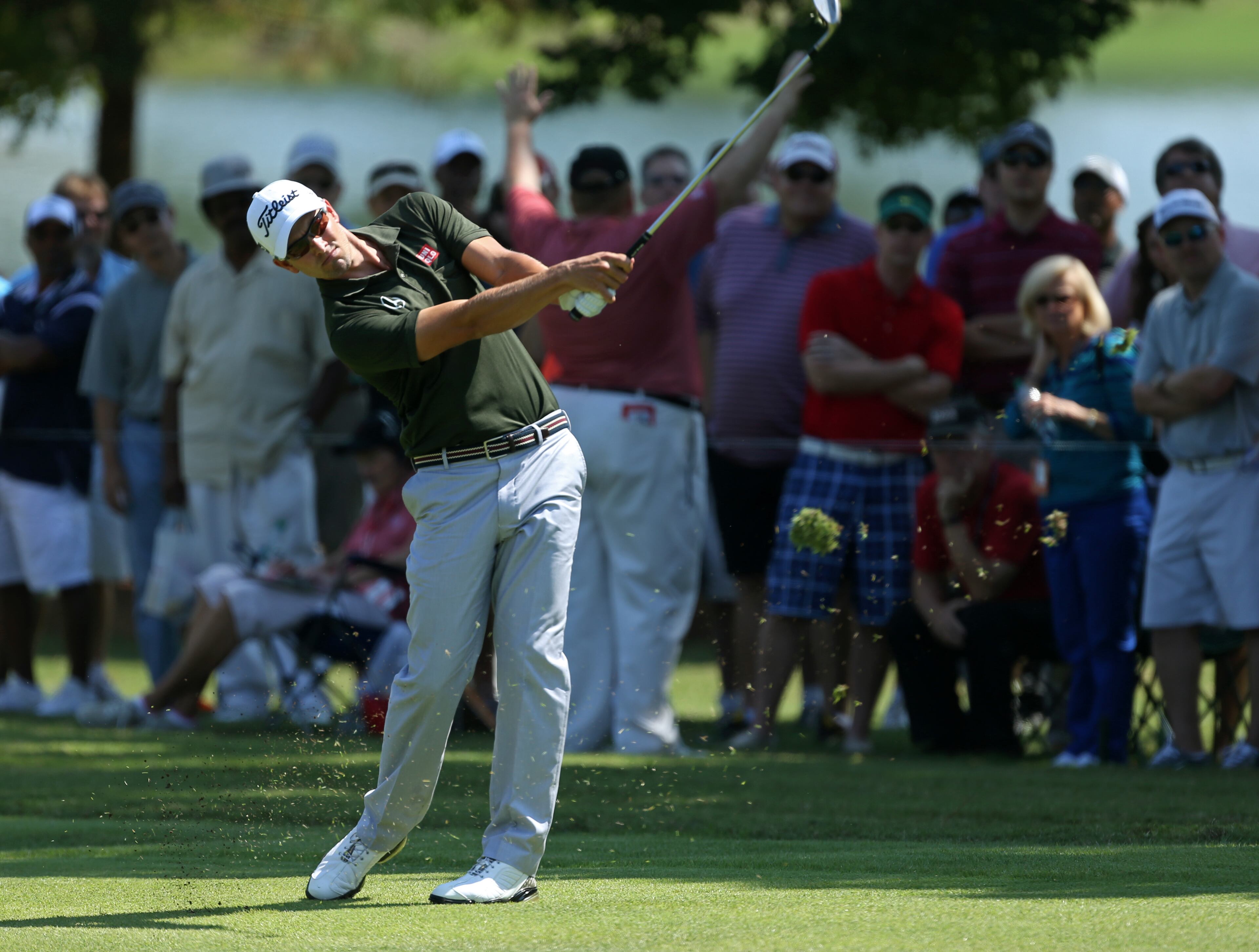 Adam Scott follows through on second shot on the No. 1 fairway during round one of the 2013 Tour Championship at East Lake Golf Club Thursday morning in Atlanta, Ga., September 19, 2013. Scott finished 2nd with a round of 5 under par.
