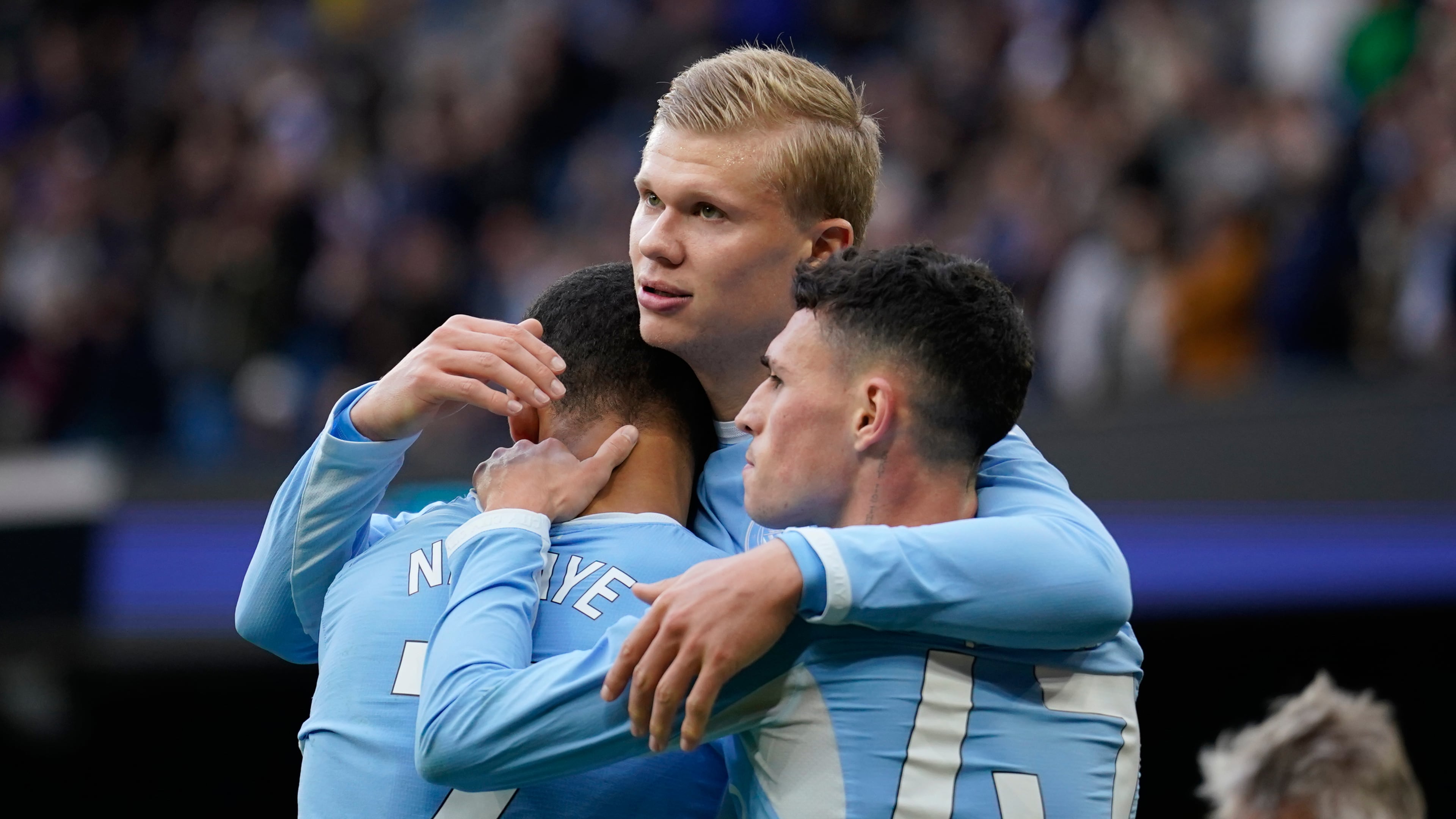 Manchester City's Erling Haaland celebrates with his teammates Phil Foden and Iliman Ndiaye after scoring his side's third goal during the English Premier League soccer match between Manchester City and Ipswich Town, in Manchester, England, Saturday, Oct.17, 2026. (AP Photo/Dave Thompson)