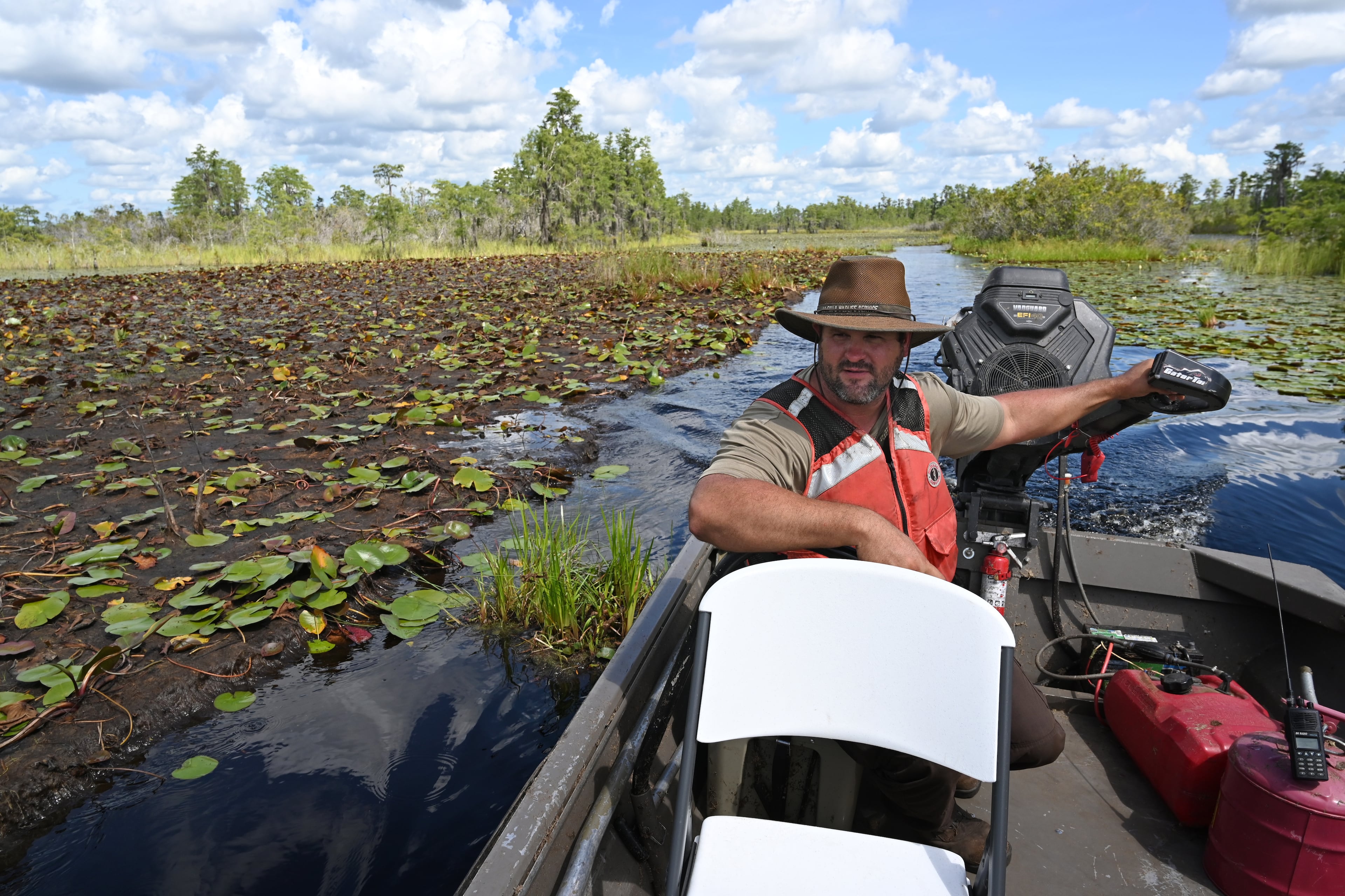 Zach Carter navigates a boat through the Okefenokee Swamp in southeast Georgia on Tuesday, Aug. 12, 2025. (Hyosub Shin/AJC)