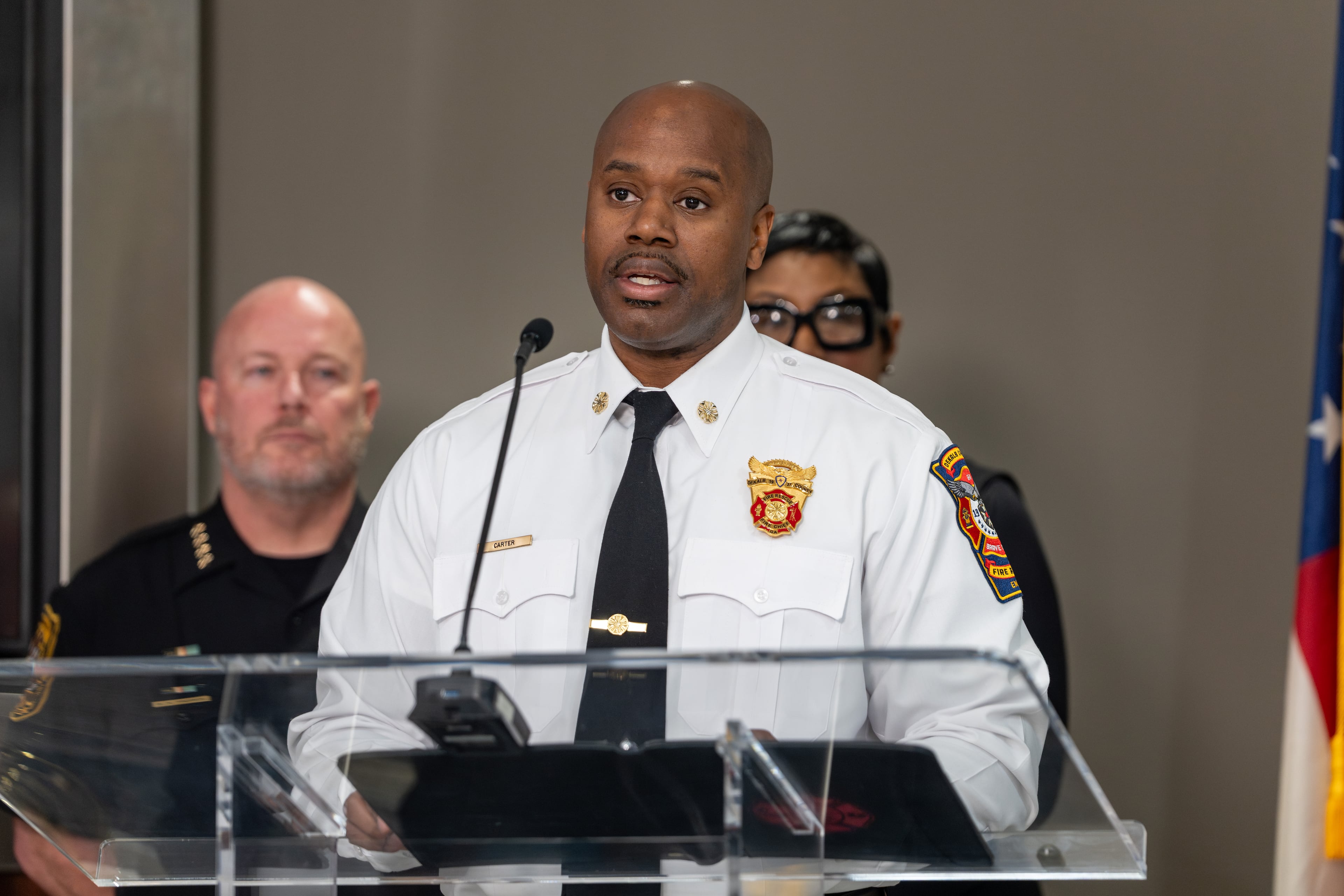 Dekalb County interim Fire Chief Melvin Carter joined other county officials at a news conference Tuesday about a string of about 15 brush fires that officials say were set within a seven-hour period in the Clarkston area. (Ben Hendren for the AJC)