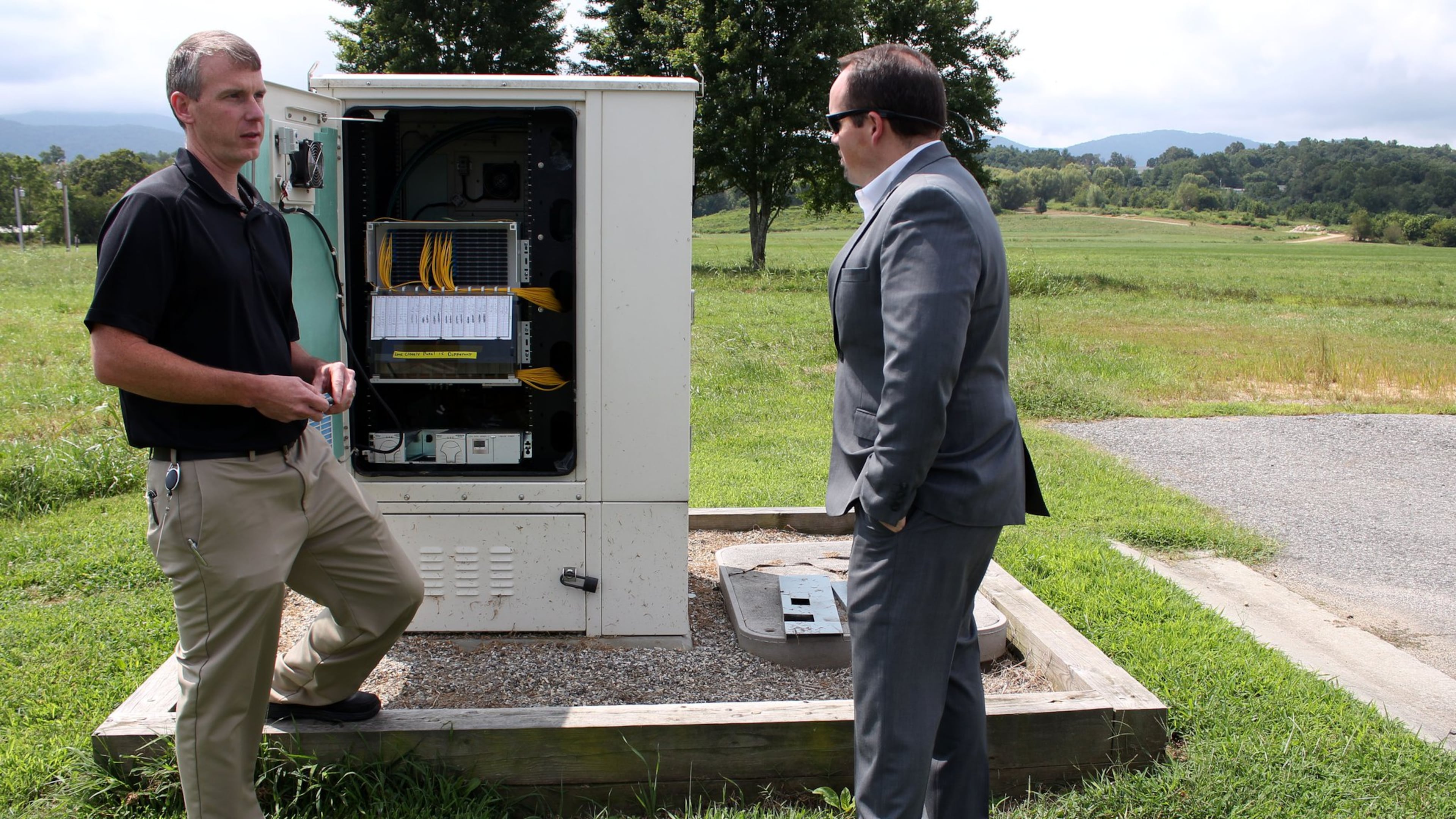 Daniel Frizzell, the director of engineering at Blue Ridge Mountain EMC, left, explains the way in which the Young Harris-based cooperative provides internet service to rural areas. Jeremy Nelms, the manager of Blue Ridge Mountain EMC, is with him. Jenna Eason / Jenna.Eason@coxinc.com