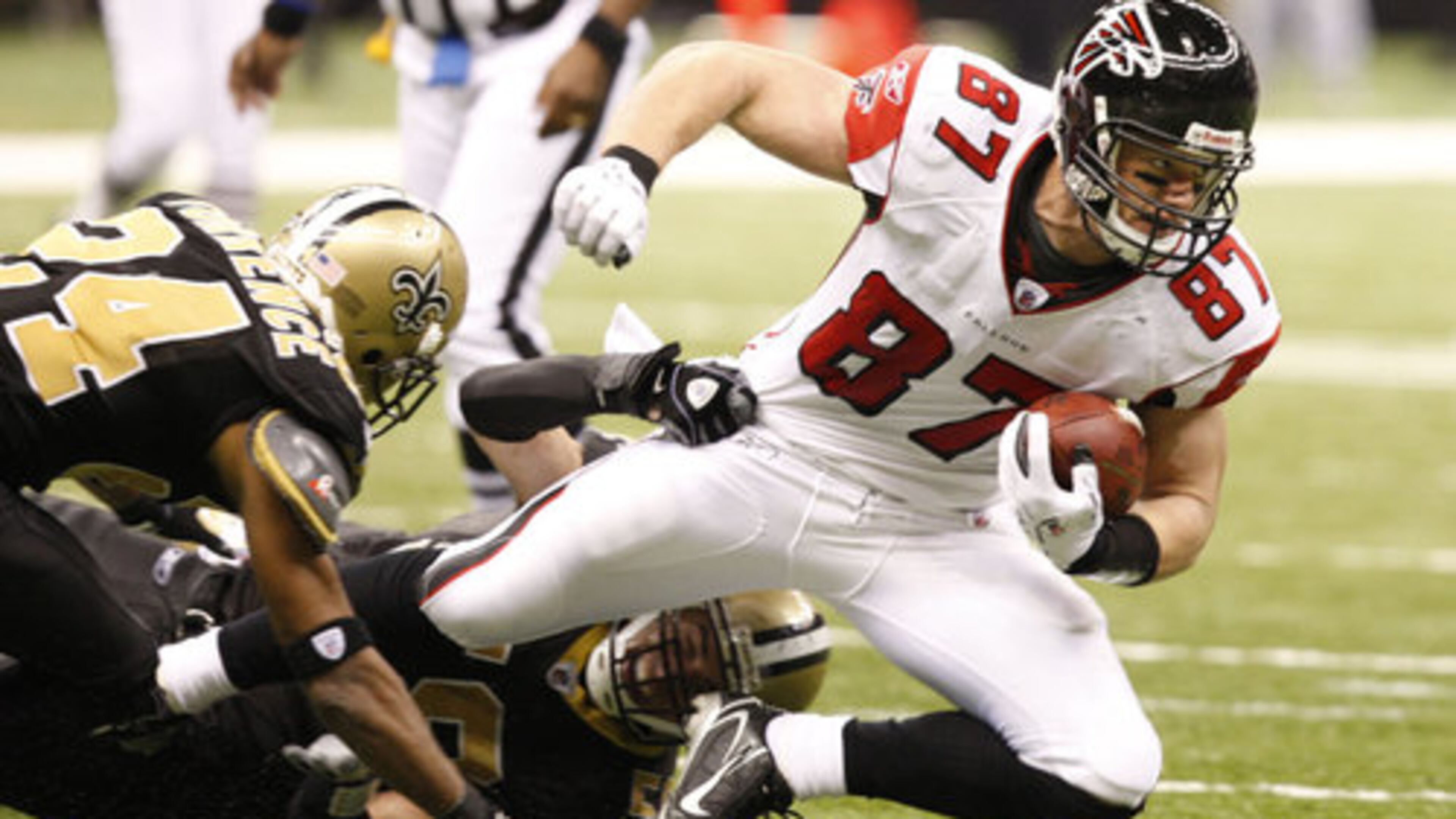 Falcons tight end Justin Peelle is dragged down after his one catch of the day for 9 yards.