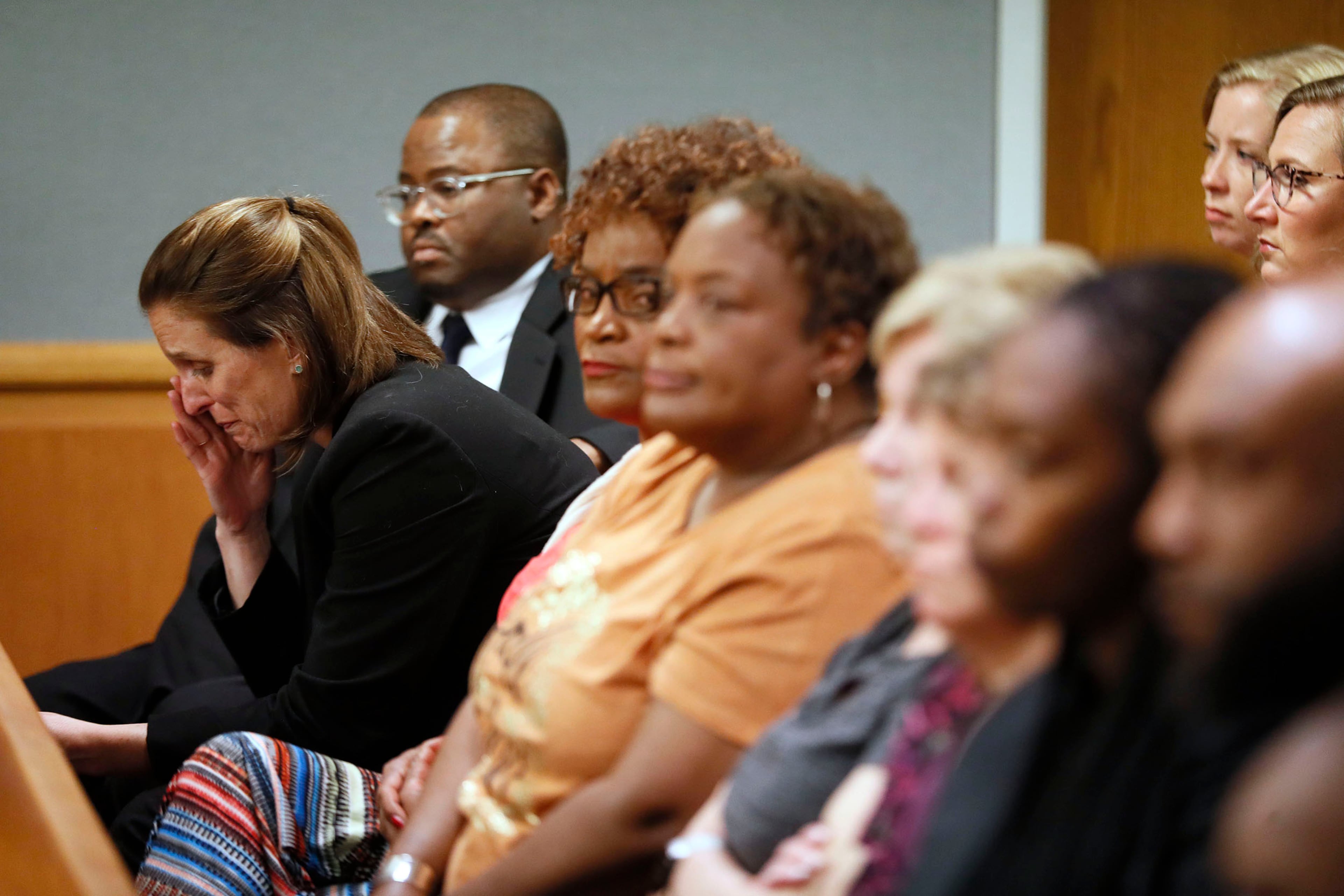 April 30, 2019 - Lawrenceville - Emily Gilbert (left) and Brad Gardner, state capital public defenders and standby council for Tiffany Moss, react to the verdict. The jury in the Tiffany Moss murder trial today sentenced her to death after they found Moss, who is representing herself, guilty of intentionally starving her 10-year-old stepdaughter Emani to death in the fall of 2013, in addition to other charges. The prosecution is asking for the death penalty. Bob Andres / bandres@ajc.com