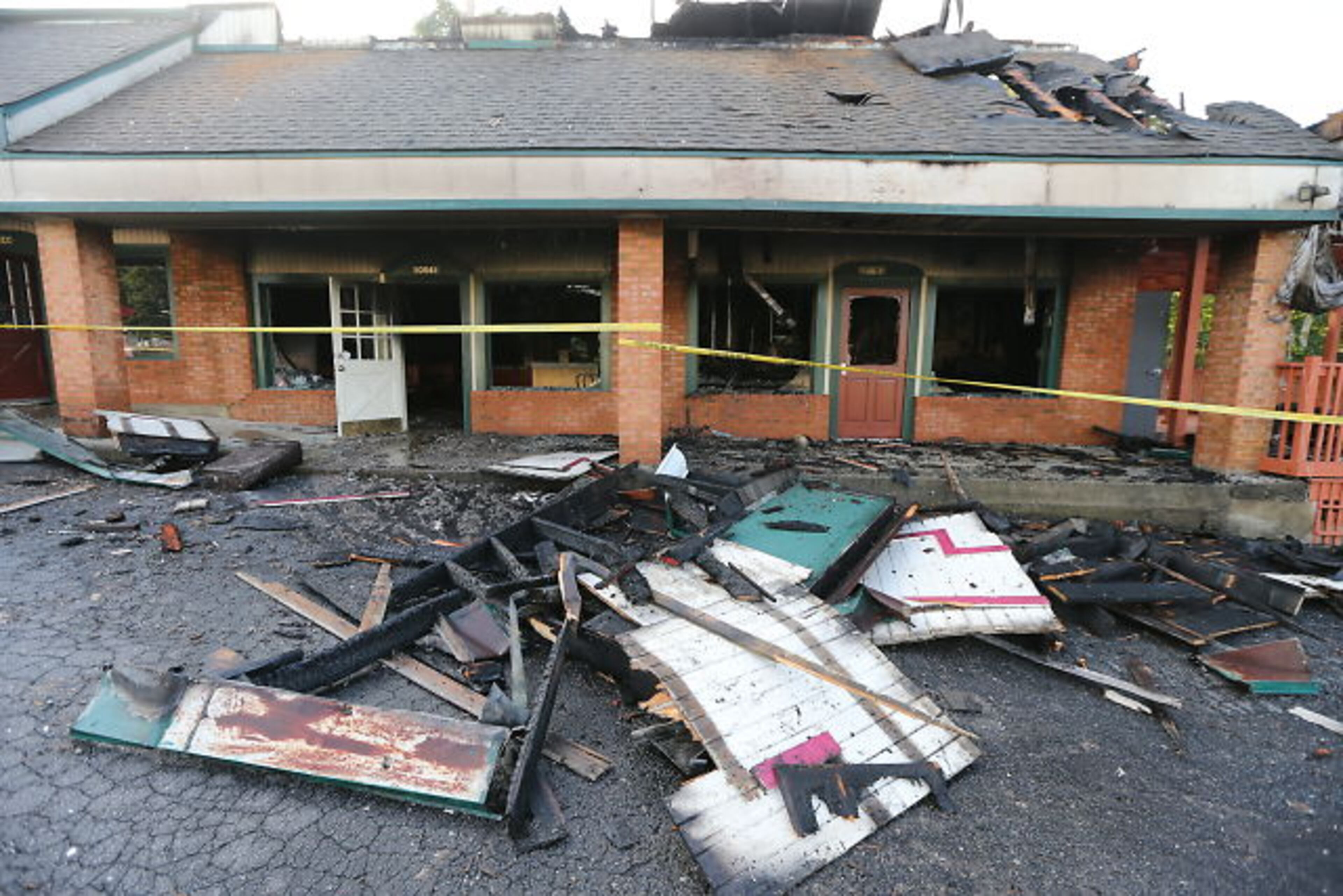 Seventeen dogs at a pet spa survived a DeKalb strip mall fire, but a Cocker Spaniel and a Shih Tzu died from smoke inhalation. JOHN SPINK / JSPINK@AJC.COM