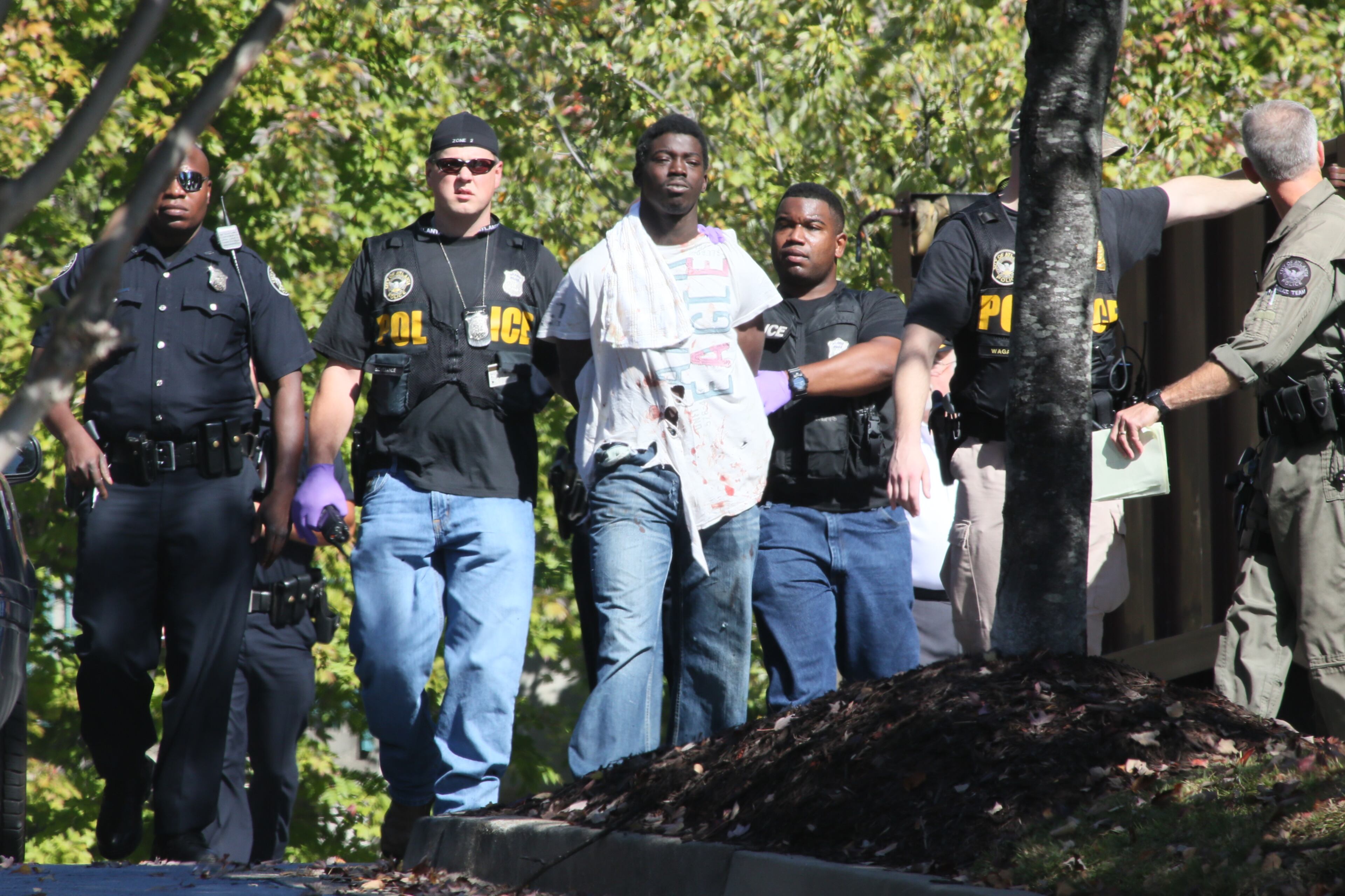 A burglary suspect surrendered to Atlanta police Thursday on the second floor of a Buckhead hotel that had been evacuated during a manhunt. The Towne Place Suites hotel at 800 Sidney Marcus Blvd. was evacuated just before the lunch hour as authorities, including a SWAT team, searched for the unidentified man.