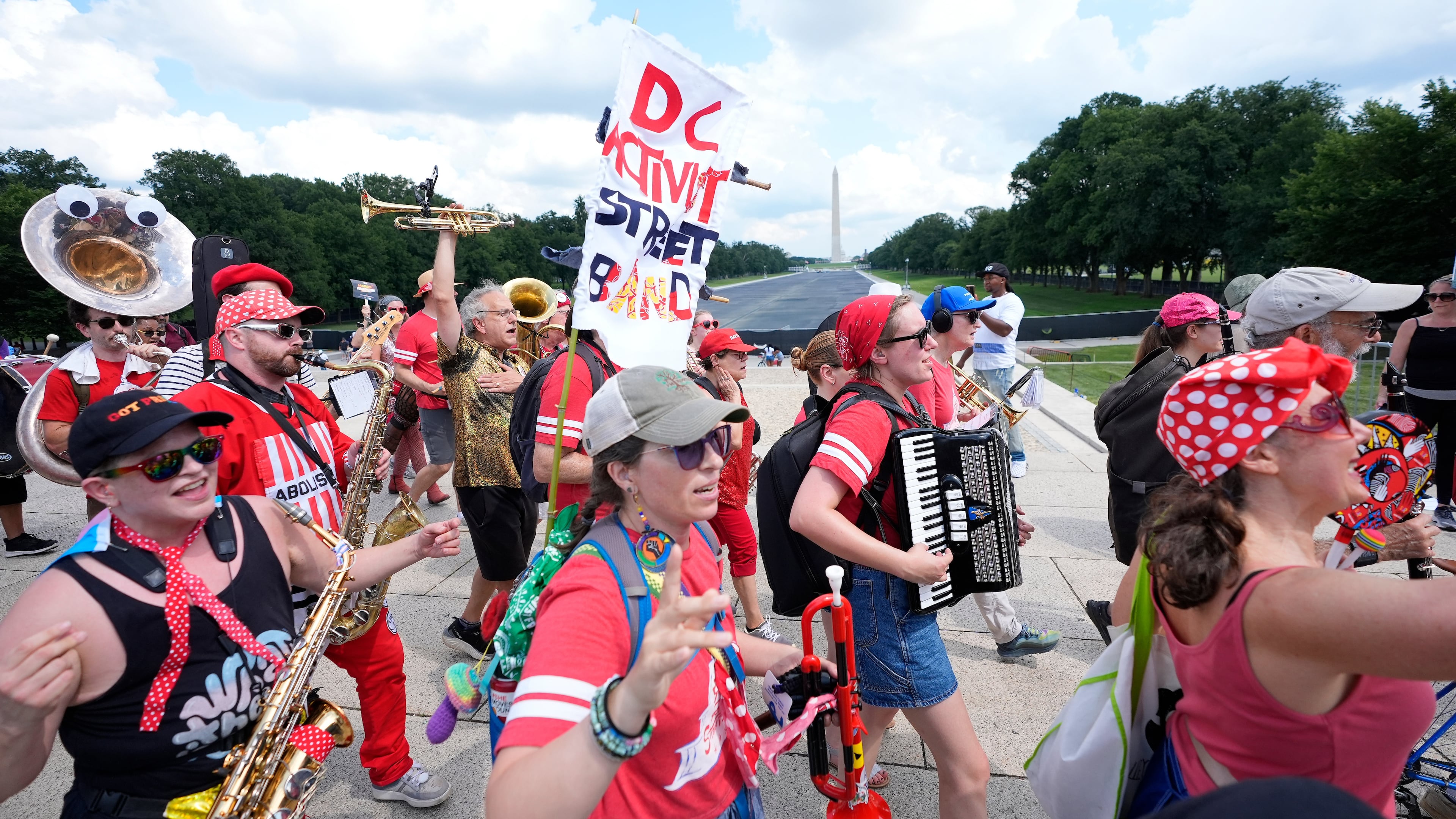 A group of local activist from Washington DC, demonstrating during the March on Washington rally at the Lincoln Memorial on the National Mall, Friday, Aug. 28, 2026 in Washington. (AP Photo/Manuel Balce Ceneta)