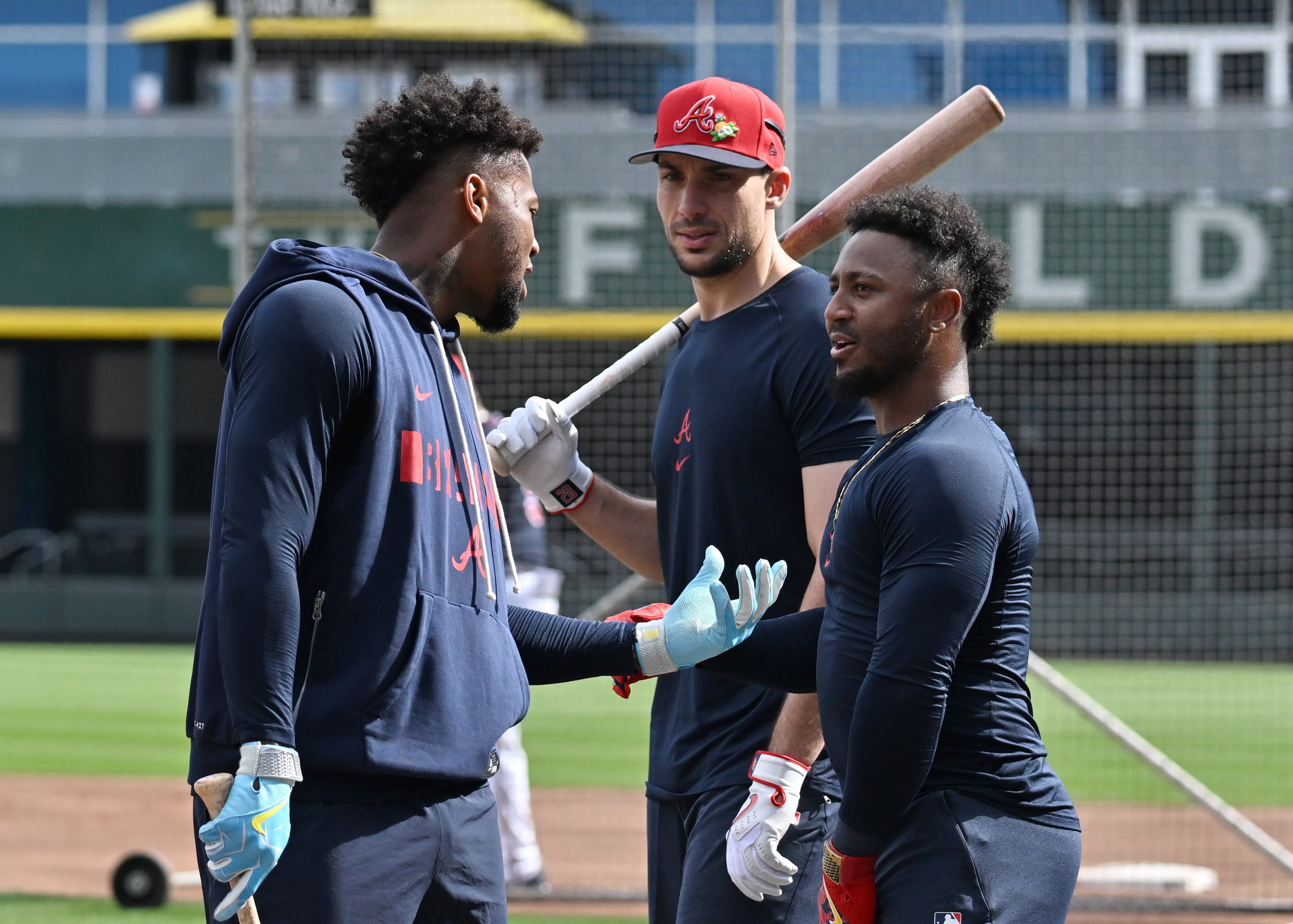 Braves right fielder Ronald Acuña Jr. (left) talks with first baseman Matt Olson (center) and second baseman Ozzie Albies during spring training workouts Wednesday, Feb. 11, 2026, at CoolToday Park in North Port, Fla. (Hyosub Shin/AJC)
