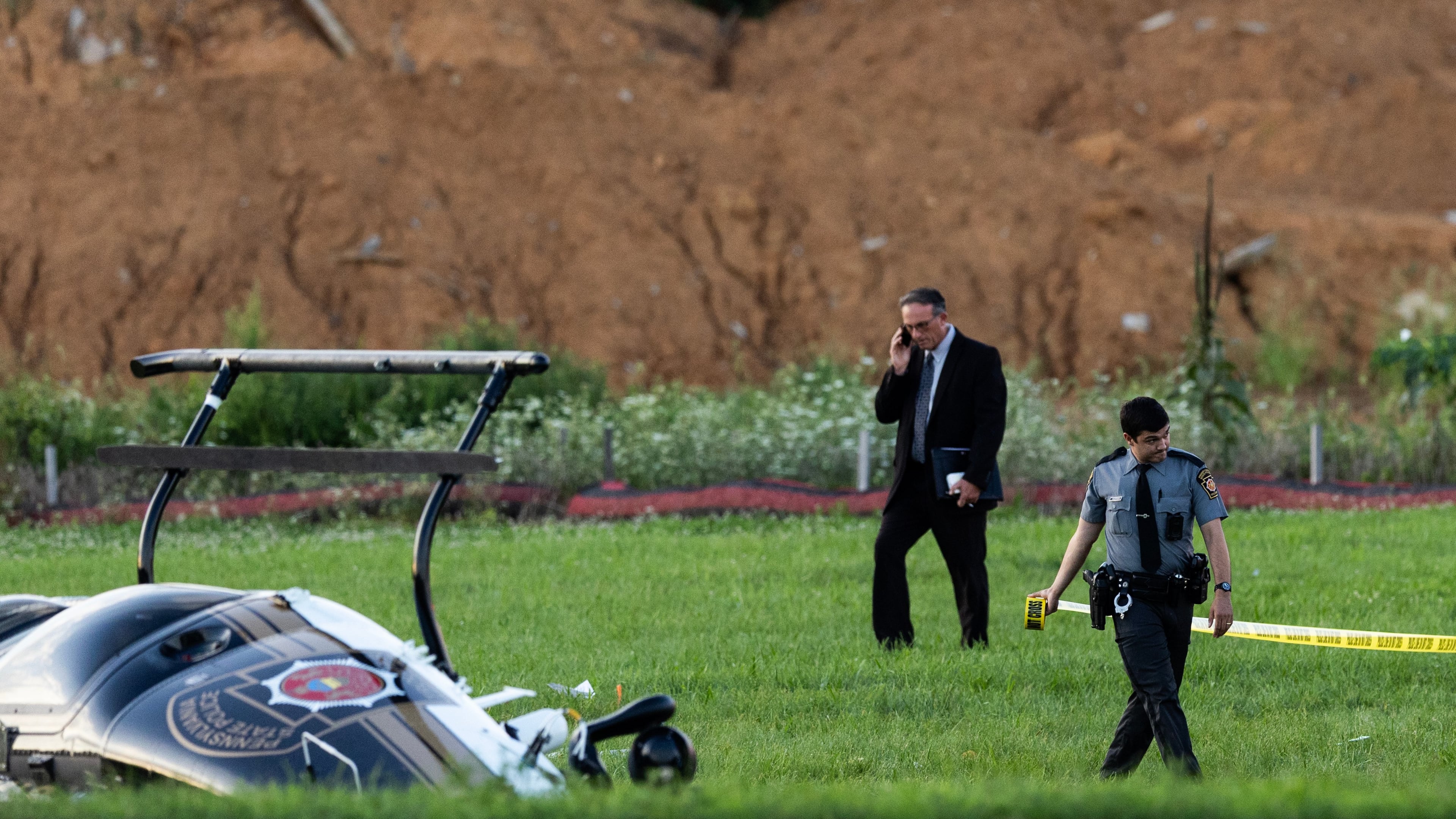 Authorities investigate a crash between a Pennsylvania State Police helicopter and a small plane at the Carlisle airport in Carlisle, Pa. Wednesday, Aug. 19, 2026. (Sean Simmers/The Patriot-News via AP)
