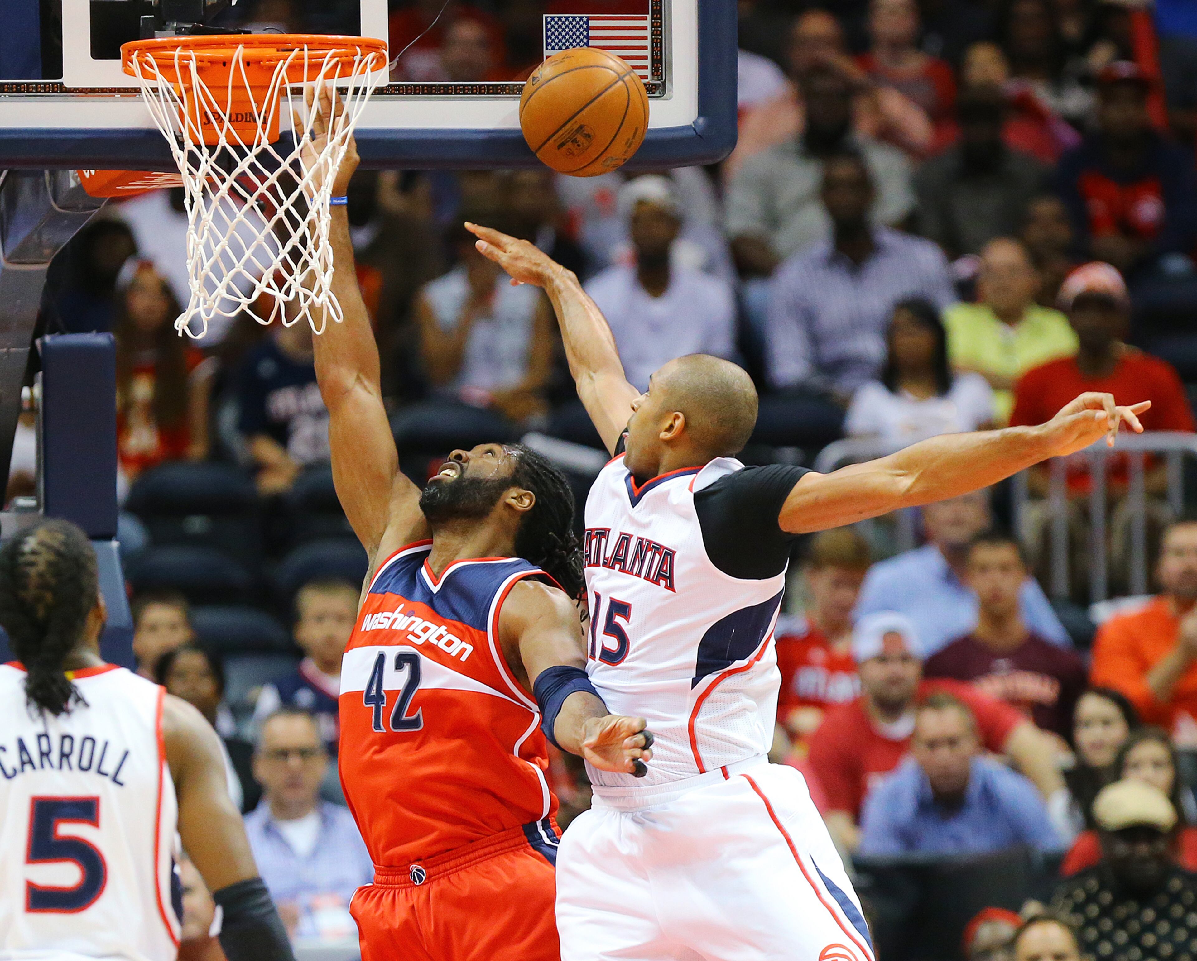 Hawks Al Horford blocks a shot by Wizards Nene in their Eastern Conference Semifinals game 5 on Tuesday, May 13, 2015, in Atlanta. Curtis Compton / ccompton@ajc.com