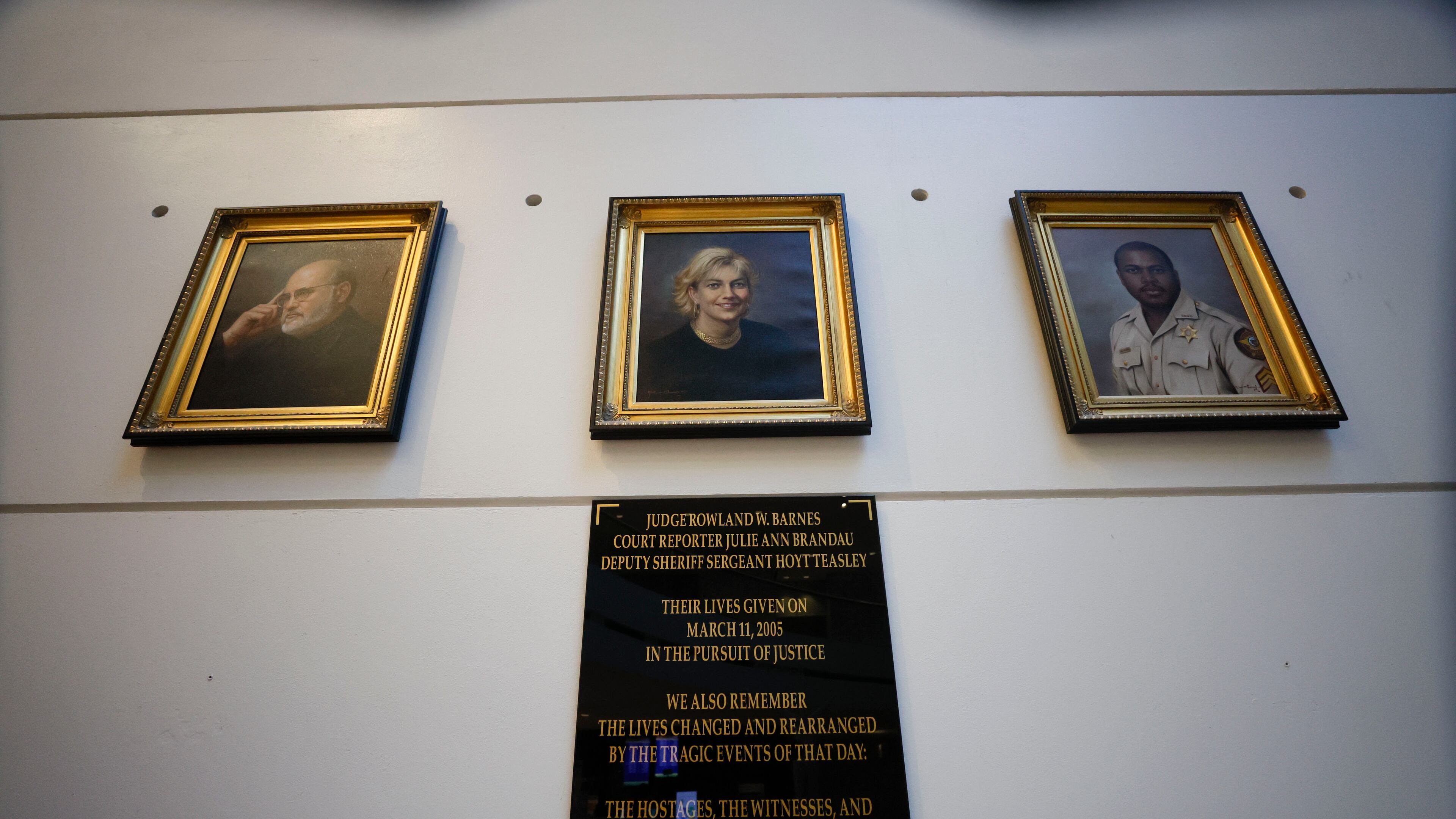A memorial located on the first floor of the Fulton County Courthouse commemorates the victims: Judge Rowland Barnes, court reporter Julie Ann Brandau and Sheriff’s Deputy Sgt. Hoyt Teasley. This marks the 20th anniversary of their deaths, resulting from the actions of Bryan Nichols on March 11, 2005.
(Miguel Martinez/ AJC)