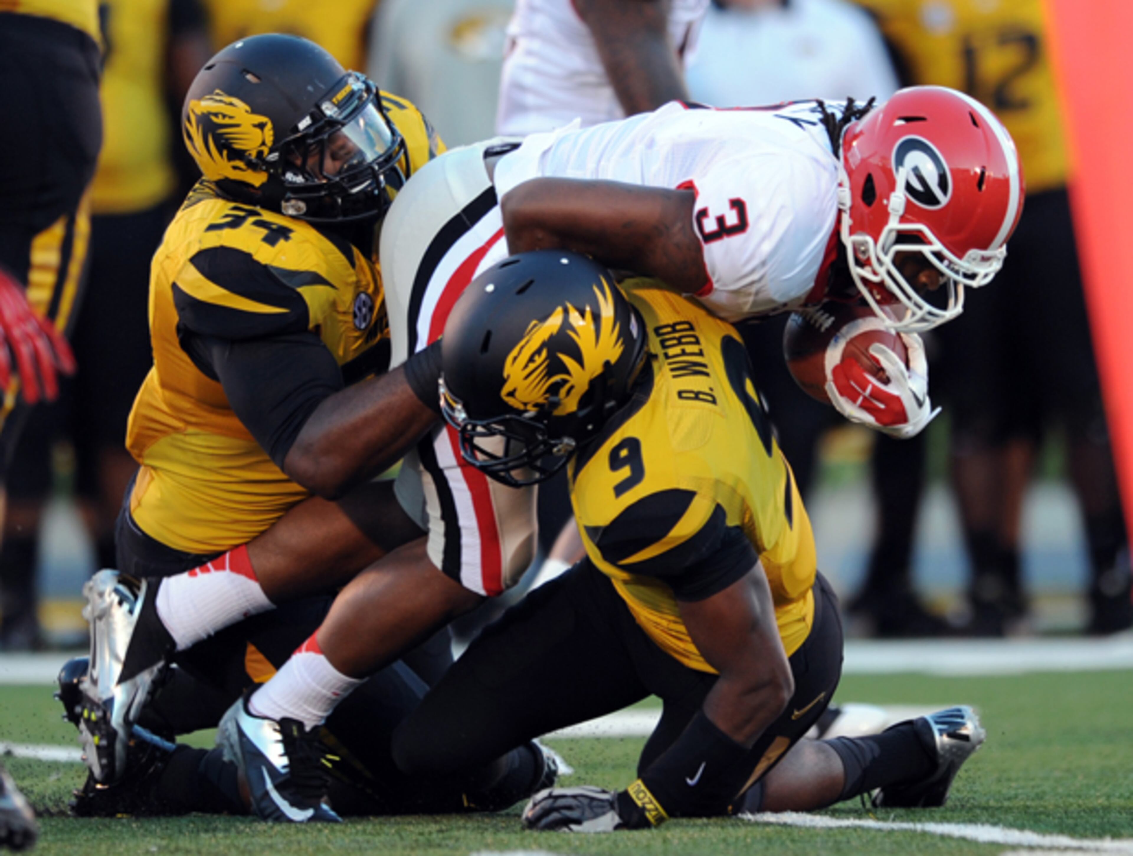 Georgia running back Todd Gurley (3) carries the ball against Missouri defensive lineman Sheldon Richardson (34) and Braylon Webb.