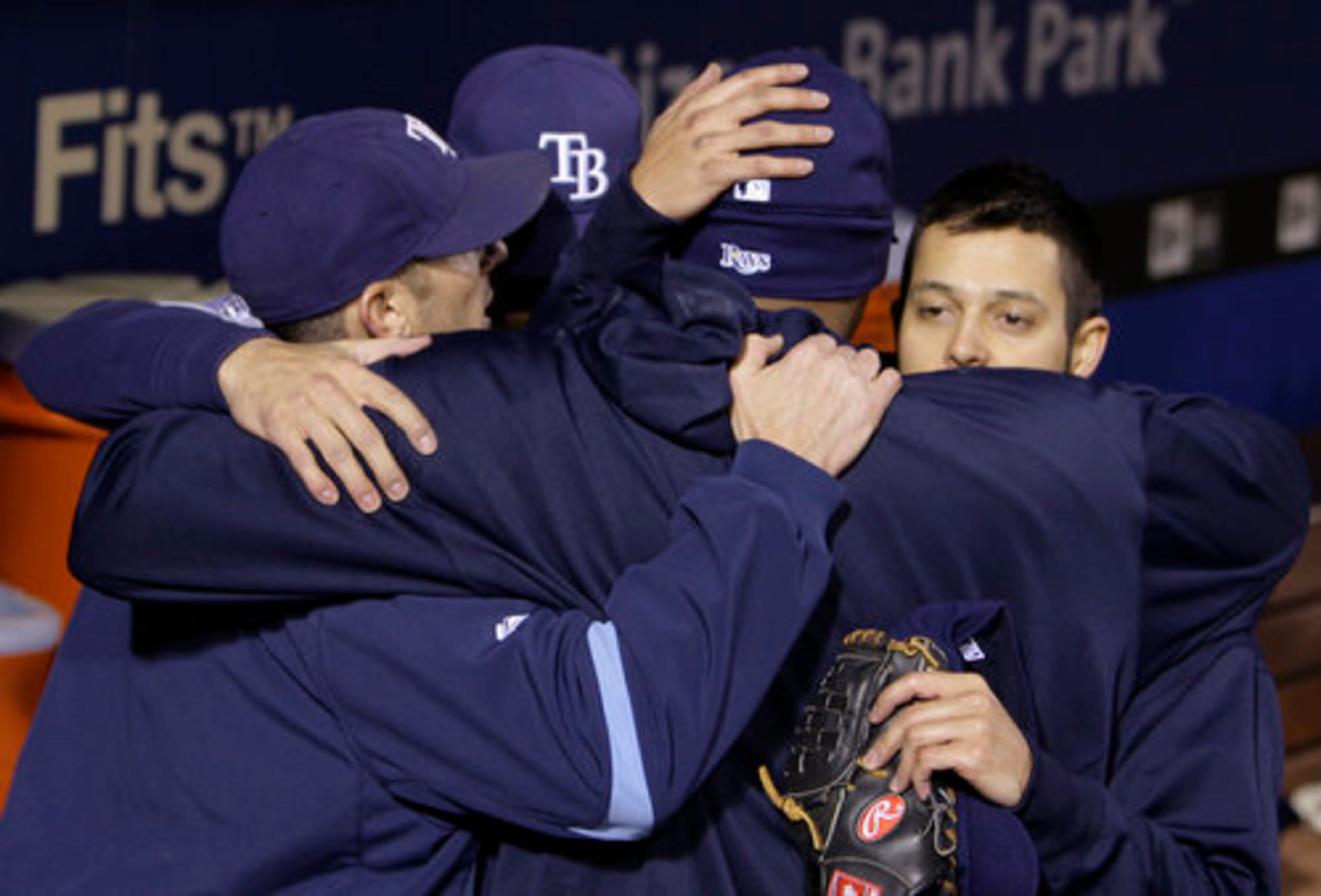 Rays players console each other after losing game 5.