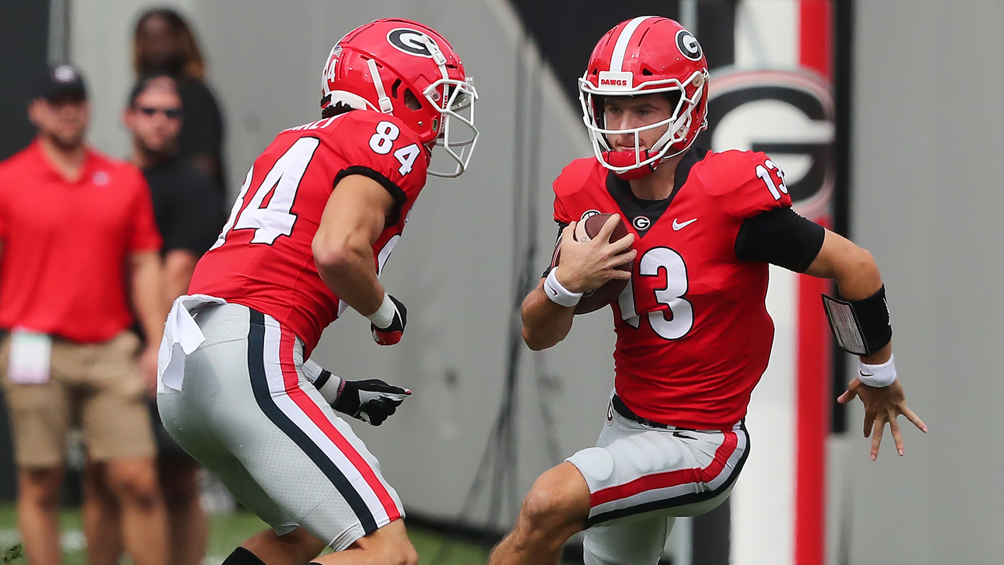 Georgia QB Stetson Bennett scrambles for yardage in the first half of Saturday's game against Arkansas. (Curtis Compton/ccompton@ajc.com)