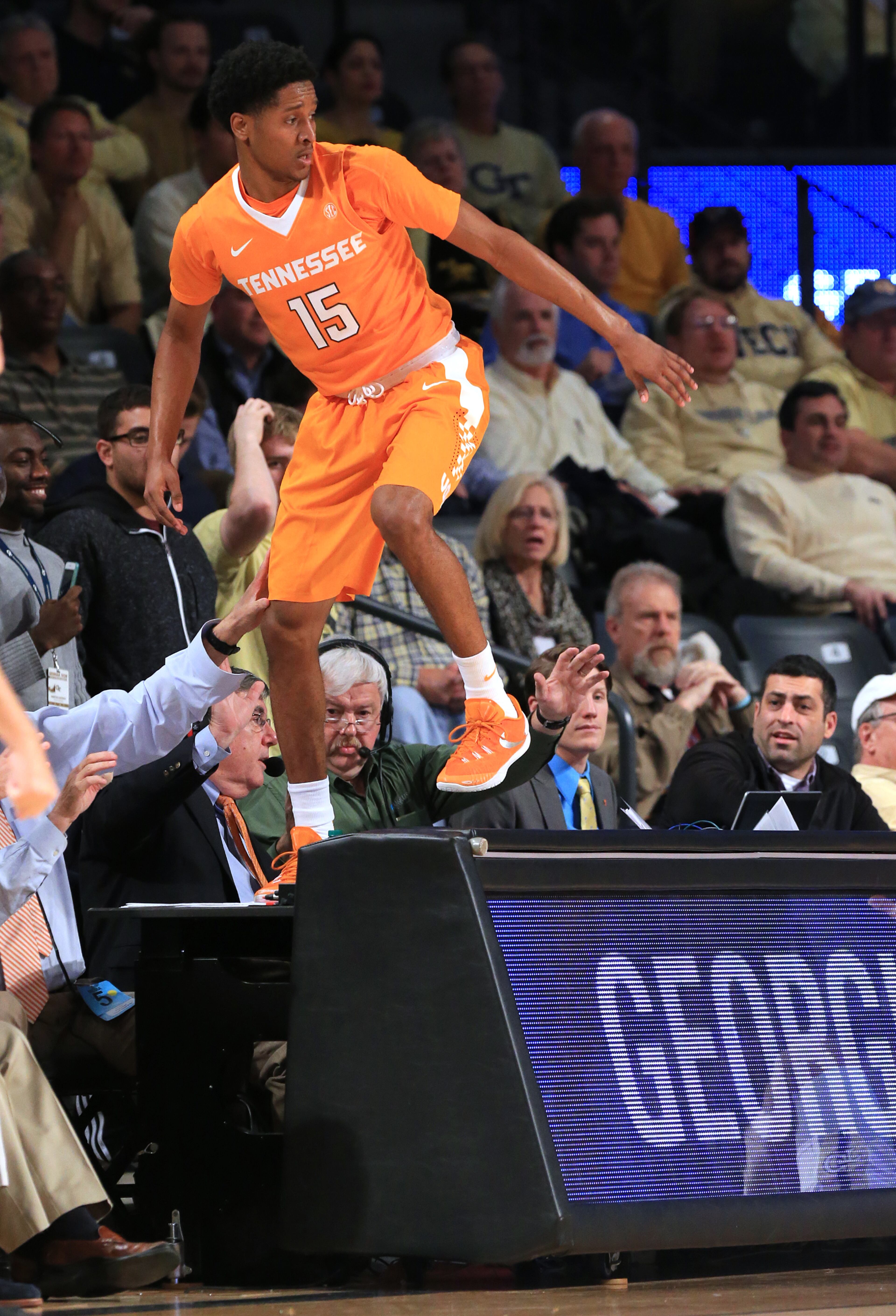 Tennessee guard Detrick Mostella goes into the crowd chasing a loose ball against Georgia Tech during the first half in a basketball game on Monday, Nov. 16, 2015 in Atlanta. Curtis Compton / ccompton@ajc.com