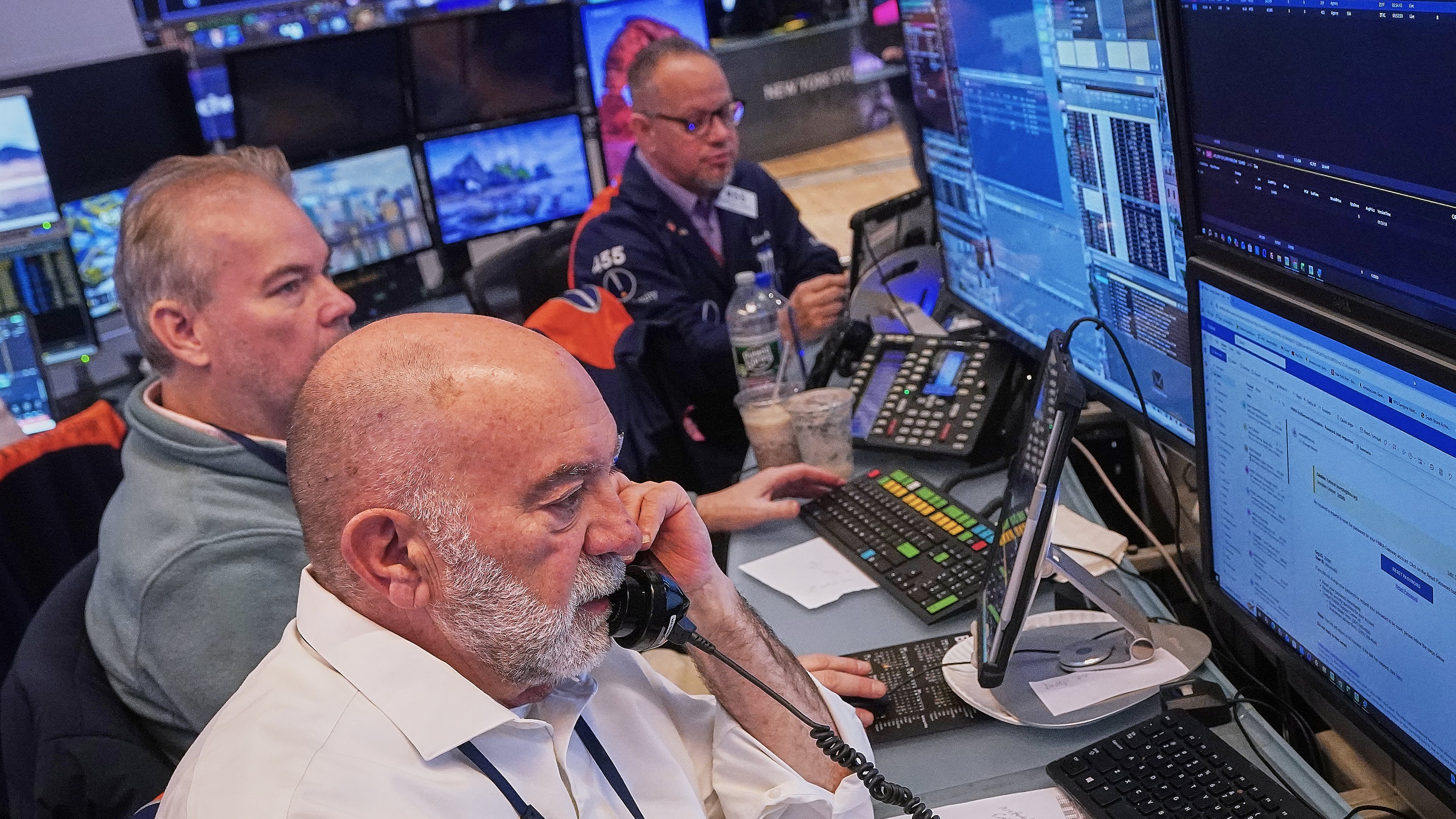 Trader Joseph Stevens, foreground, works with colleagues on the floor of the New York Stock Exchange, Tuesday, Feb. 3, 2026. (AP Photo/Richard Drew)